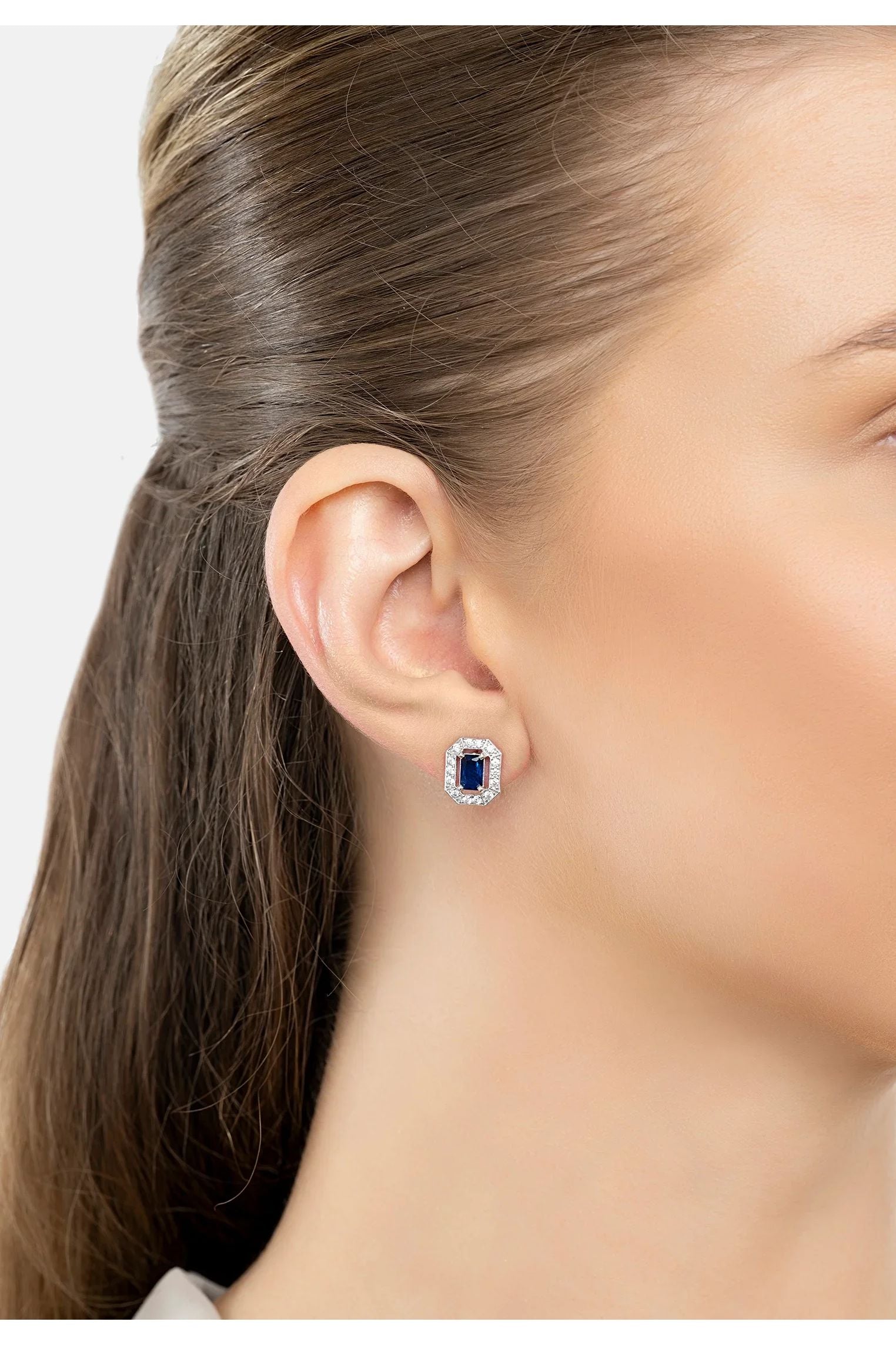 The earring worn by a model.