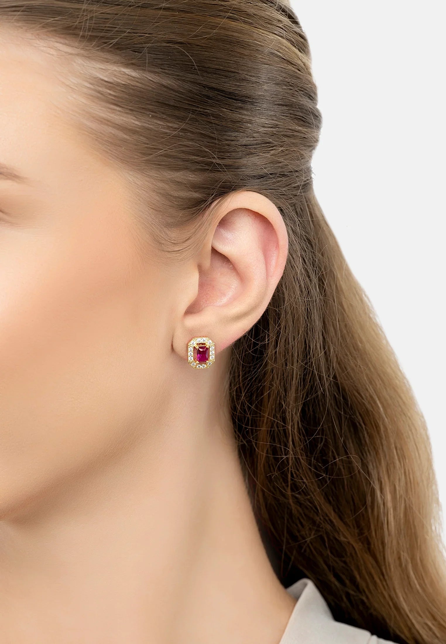 The earring worn by a model.