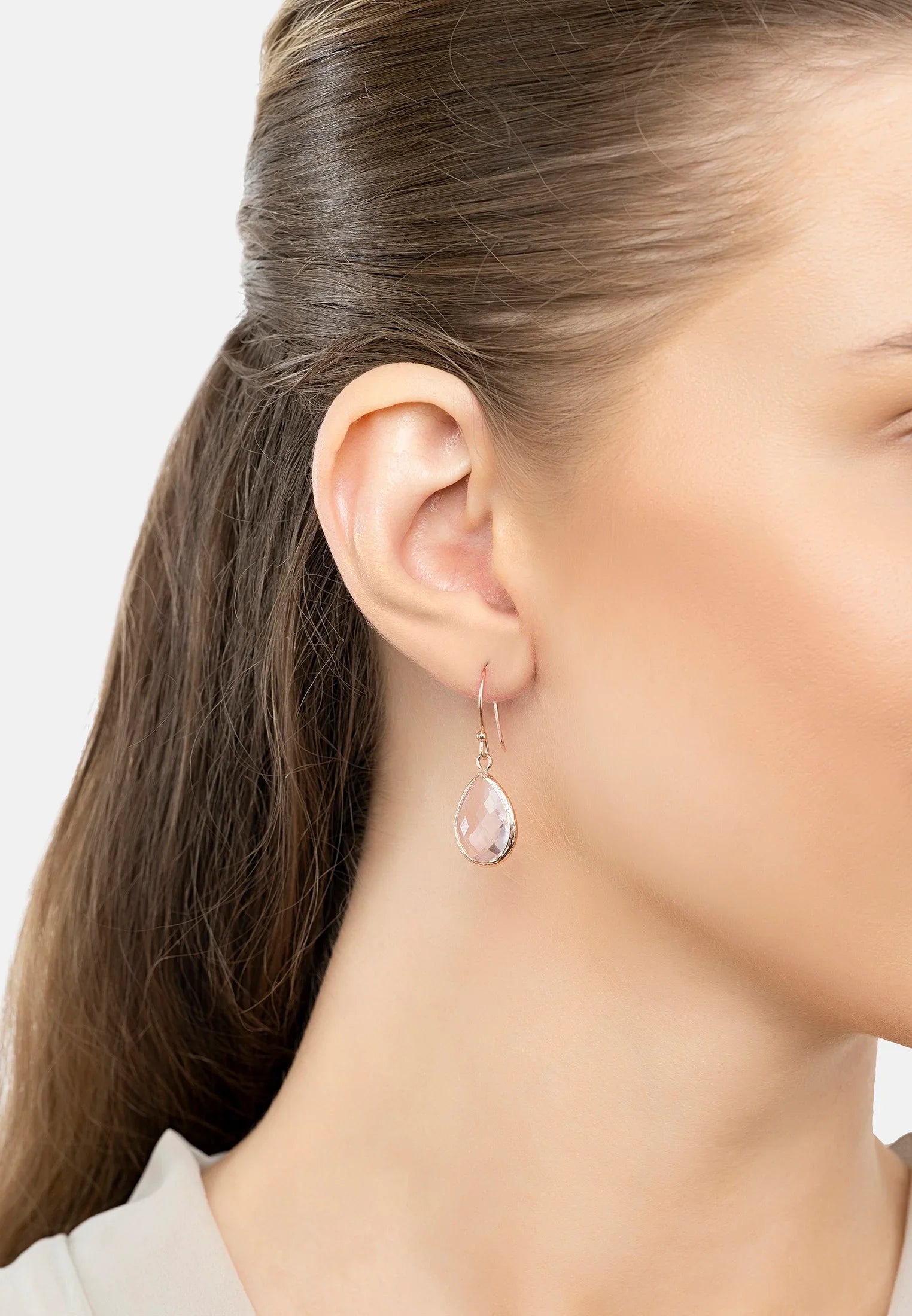 The earring worn by a model.