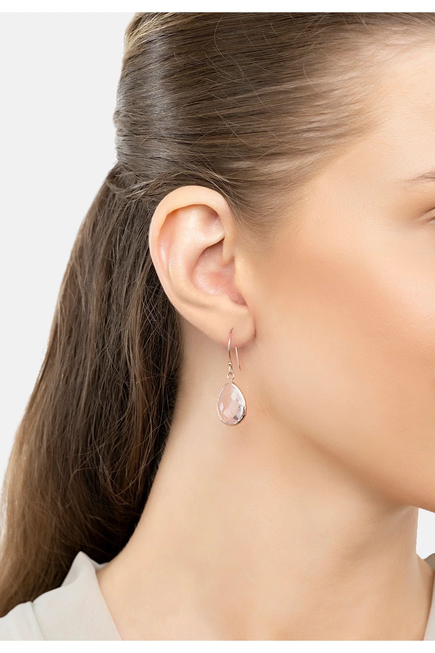 The earring worn by a model.
