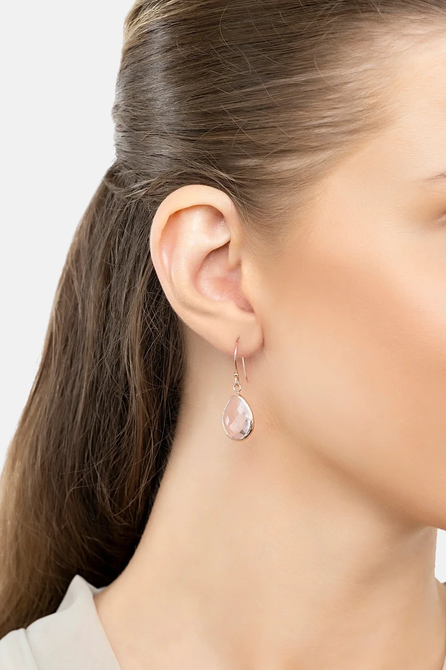 The earring worn by a model.
