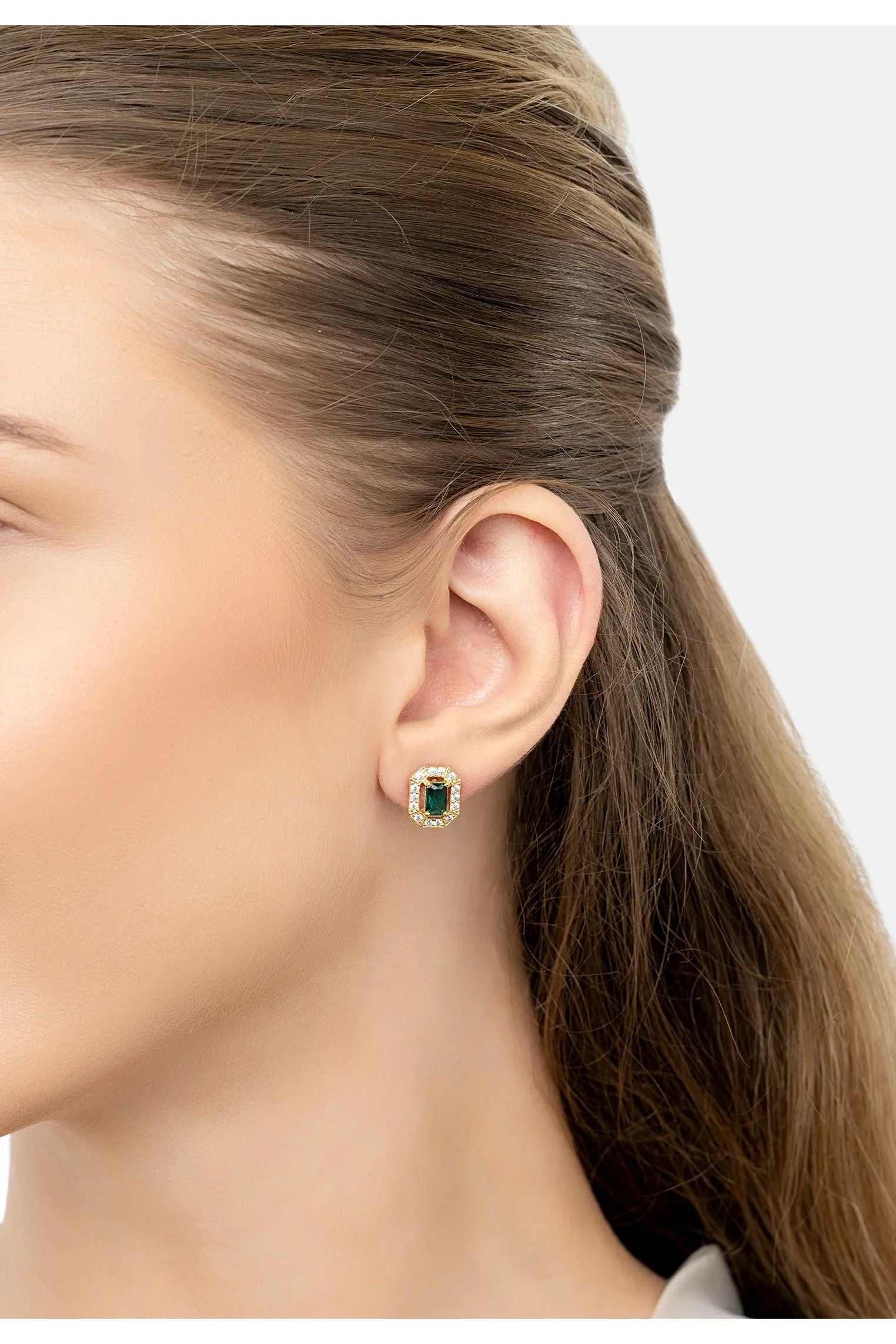 The earring worn by a model.