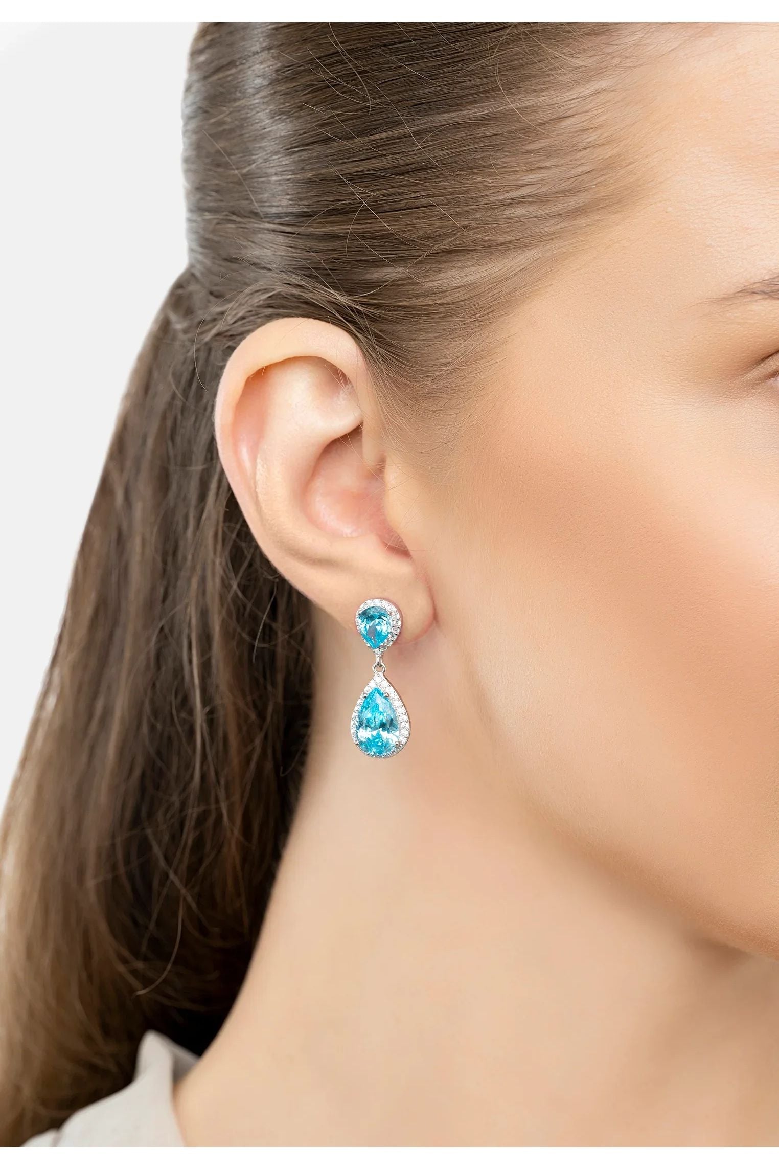 The earring worn by a model.