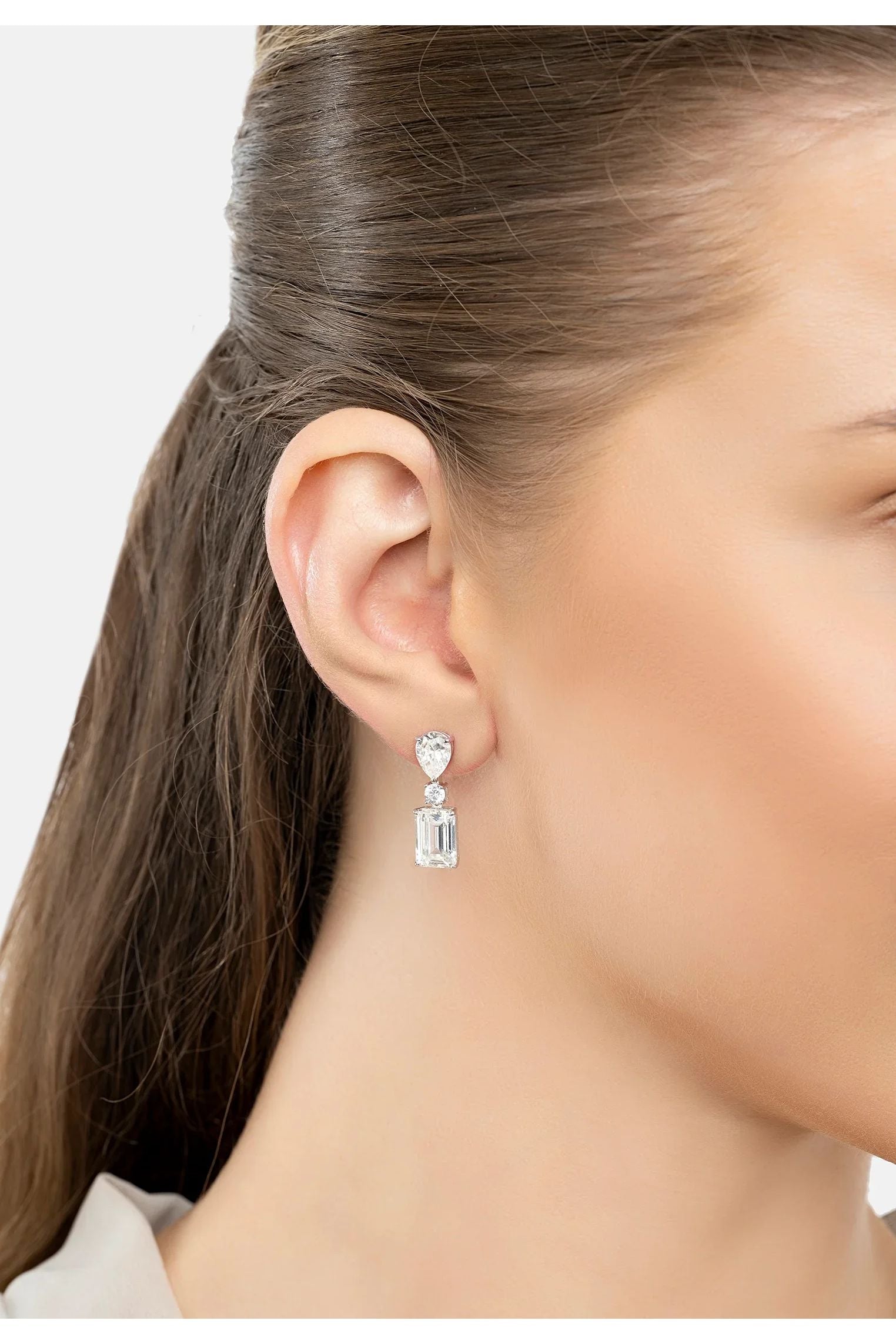 The earring worn by a model.