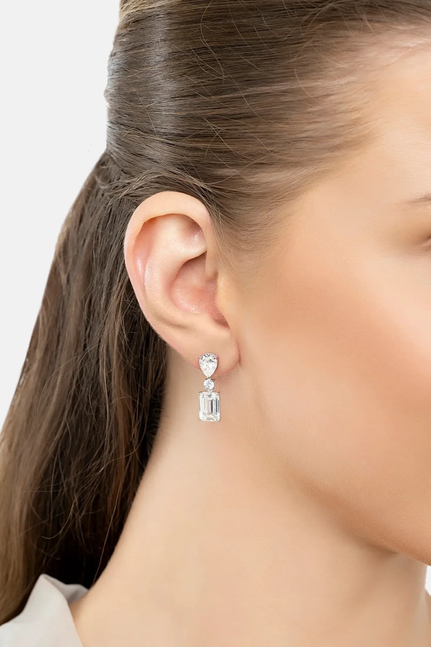 The earring worn by a model.