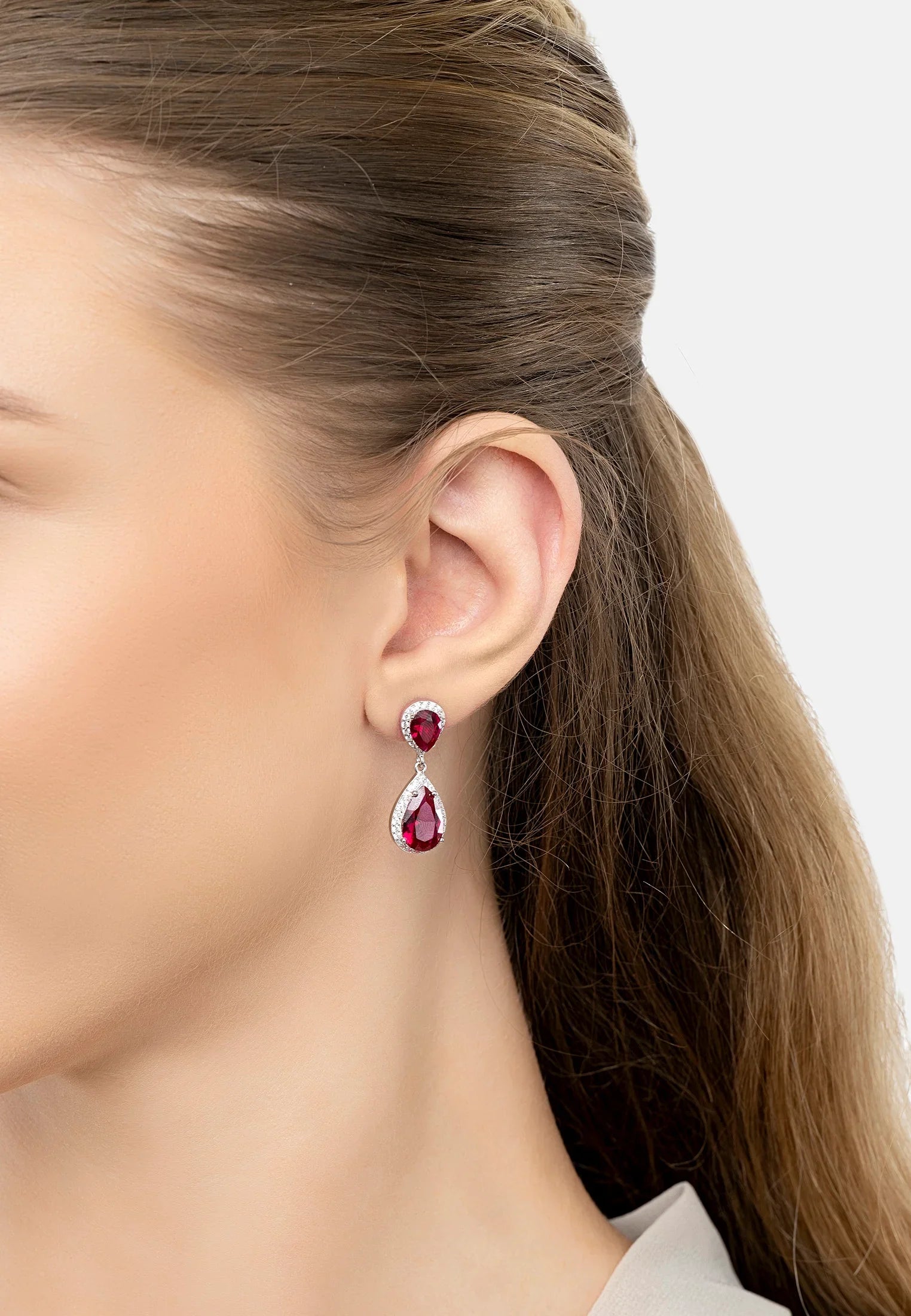 The earring worn by a model.