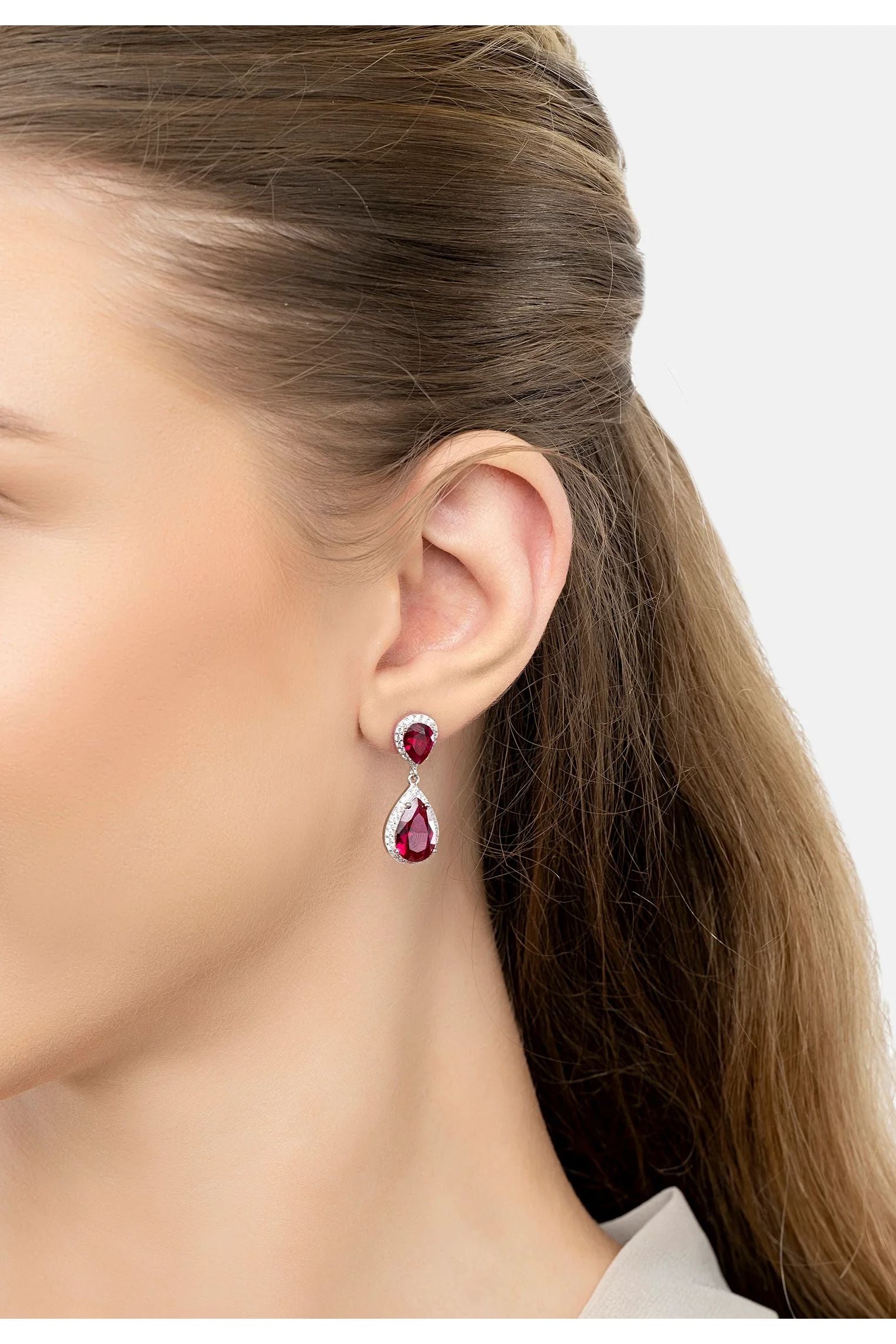The earring worn by a model.
