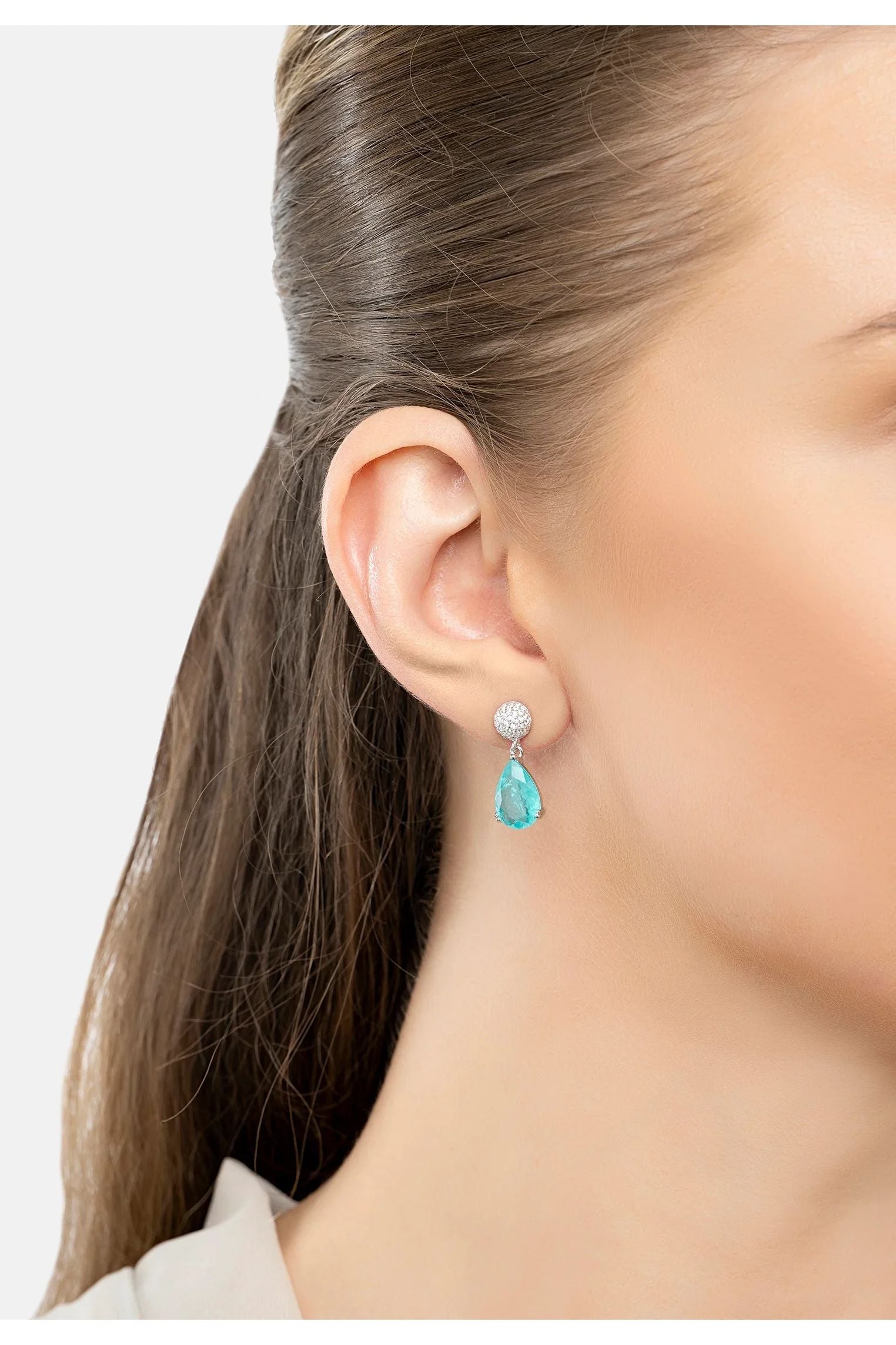 The earring worn by a model.
