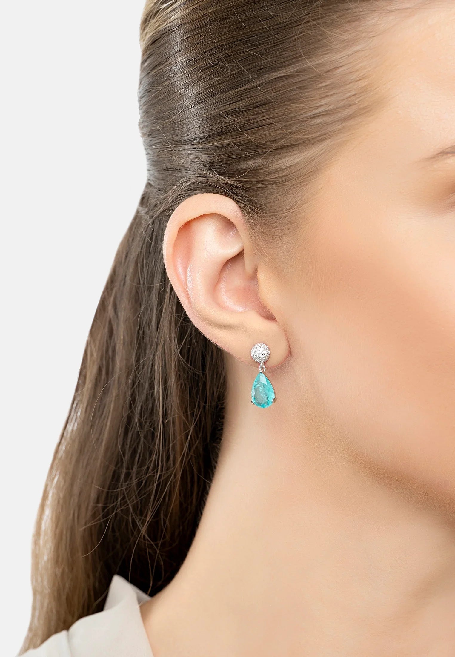 The earring worn by a model.