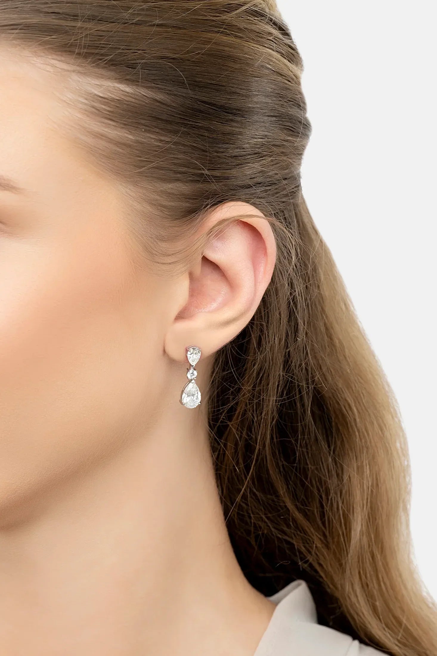 The earring worn by a model.