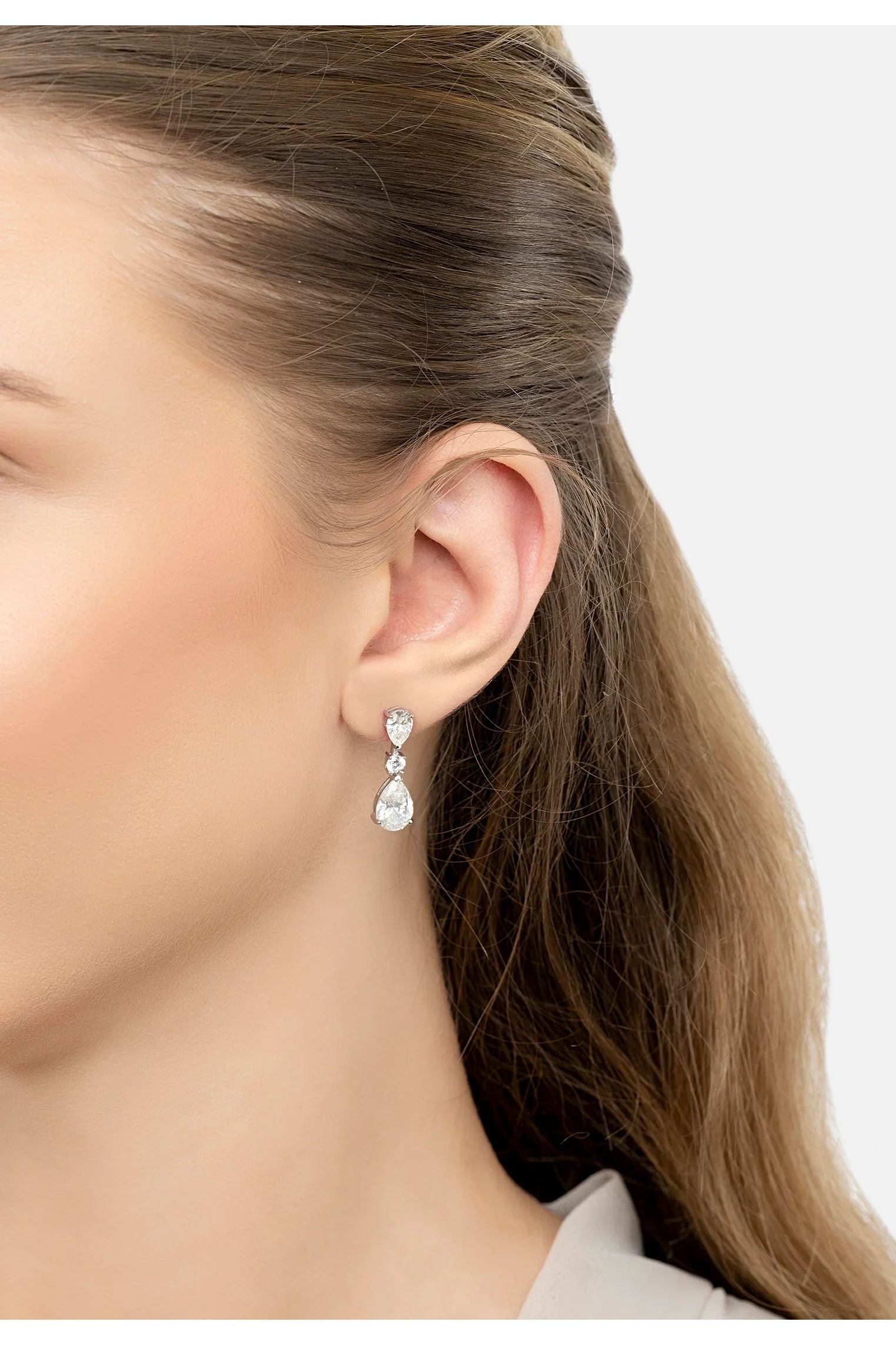 The earring worn by a model.