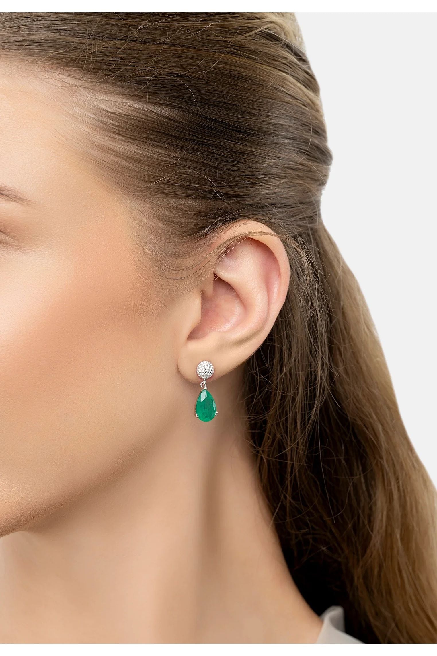 The earring worn by a model.