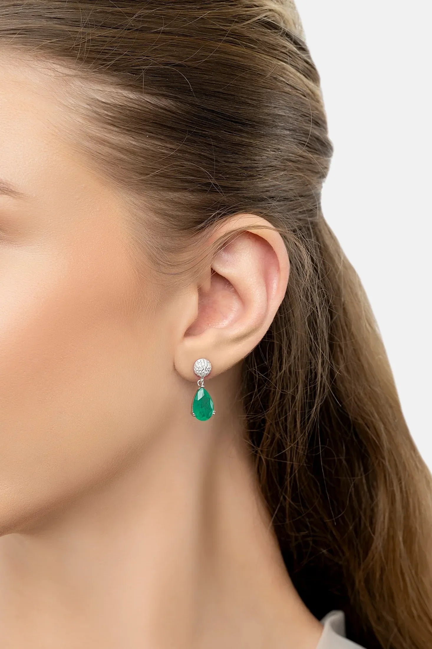The earring worn by a model.