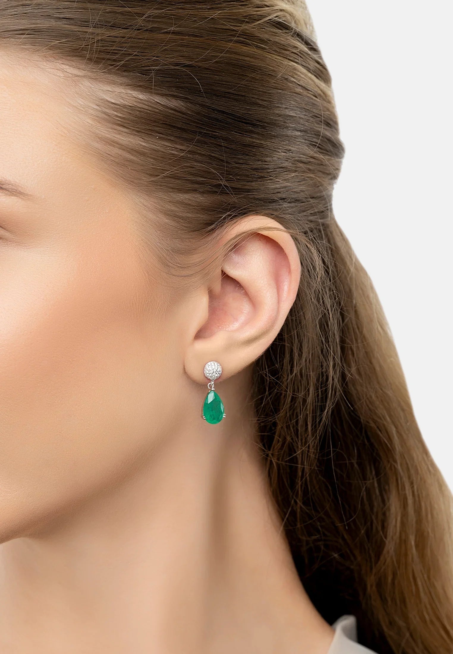 The earring worn by a model.