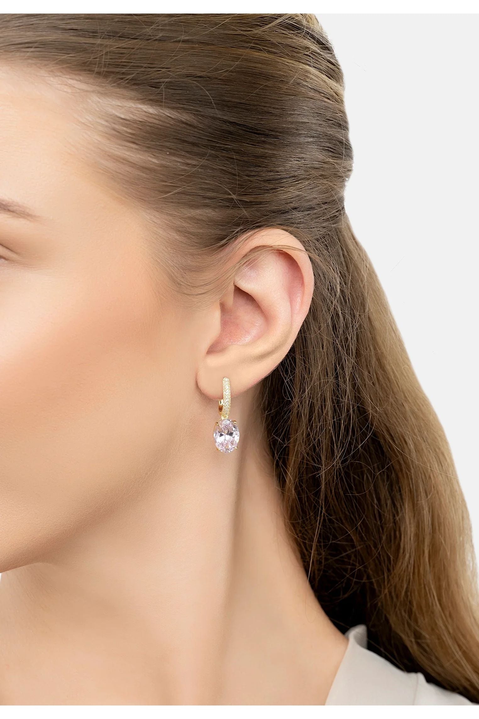 The earring worn by a model.