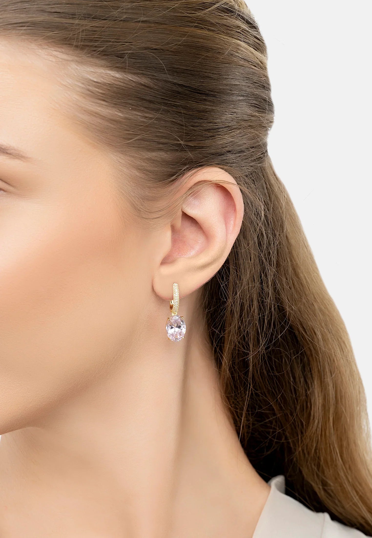 The earring worn by a model.