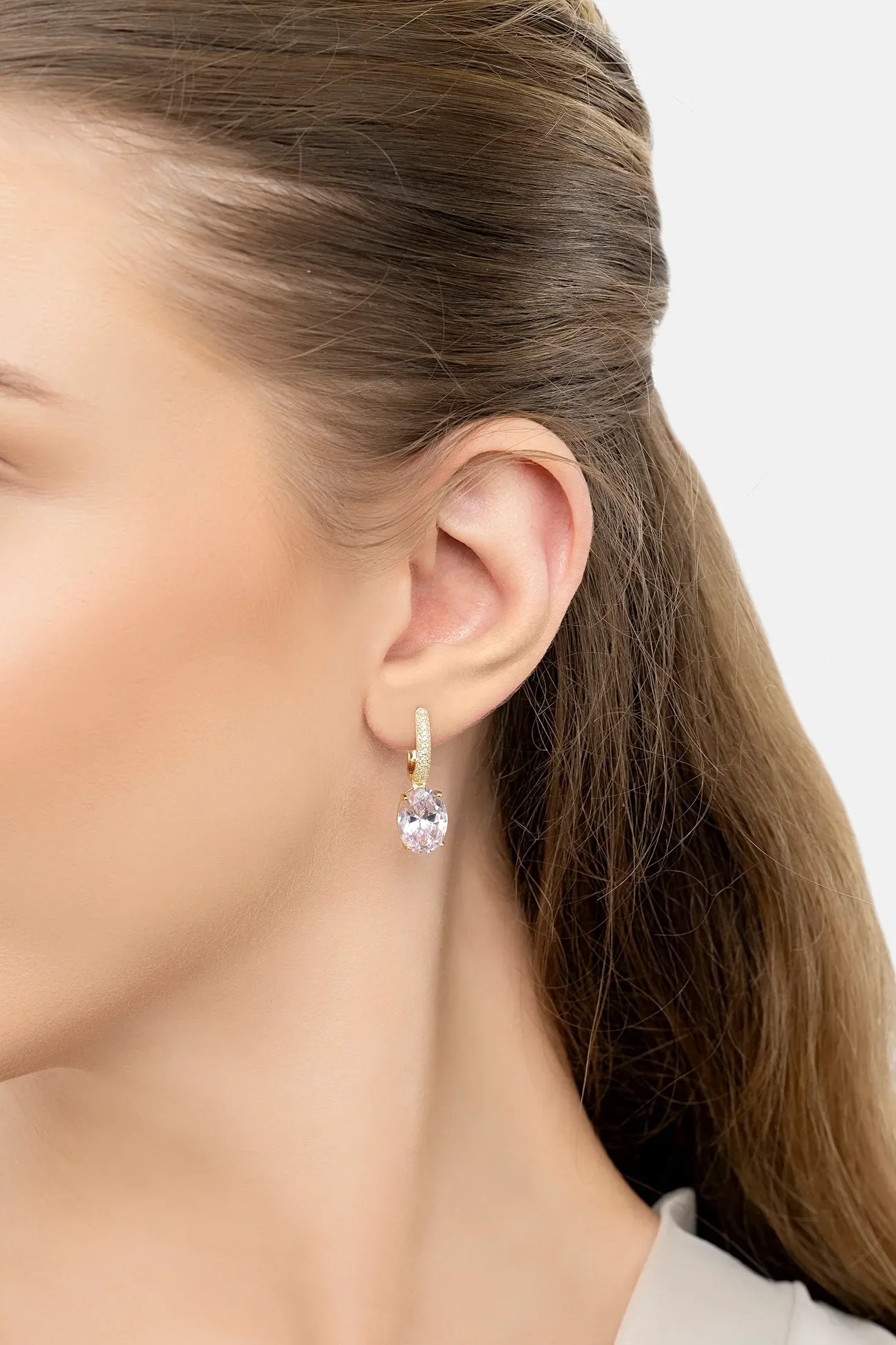 The earring worn by a model.