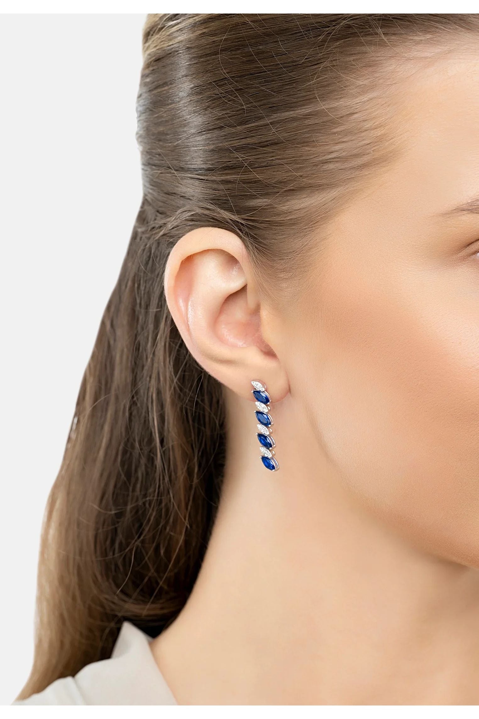 The earring worn by a model.