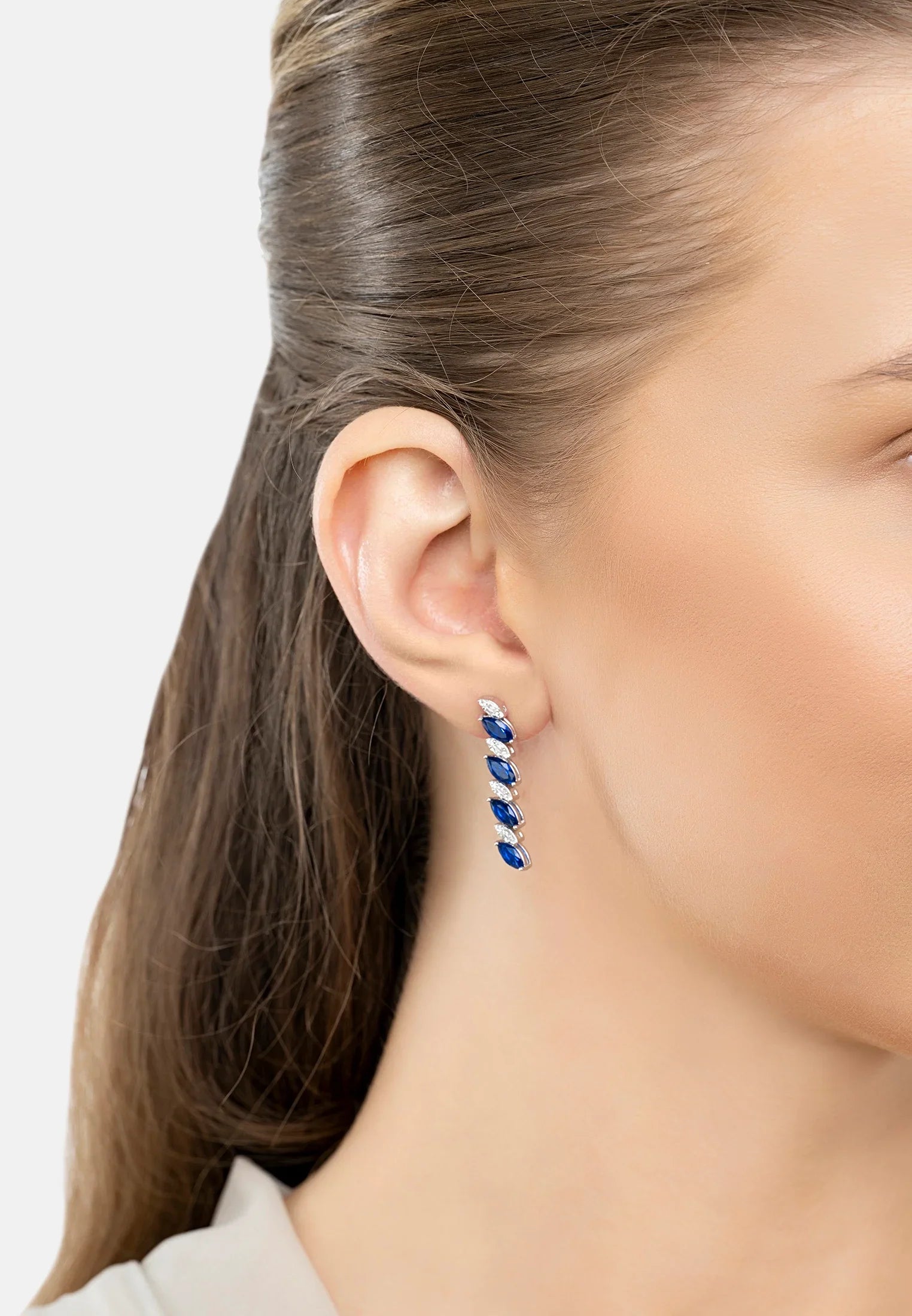 The earring worn by a model.