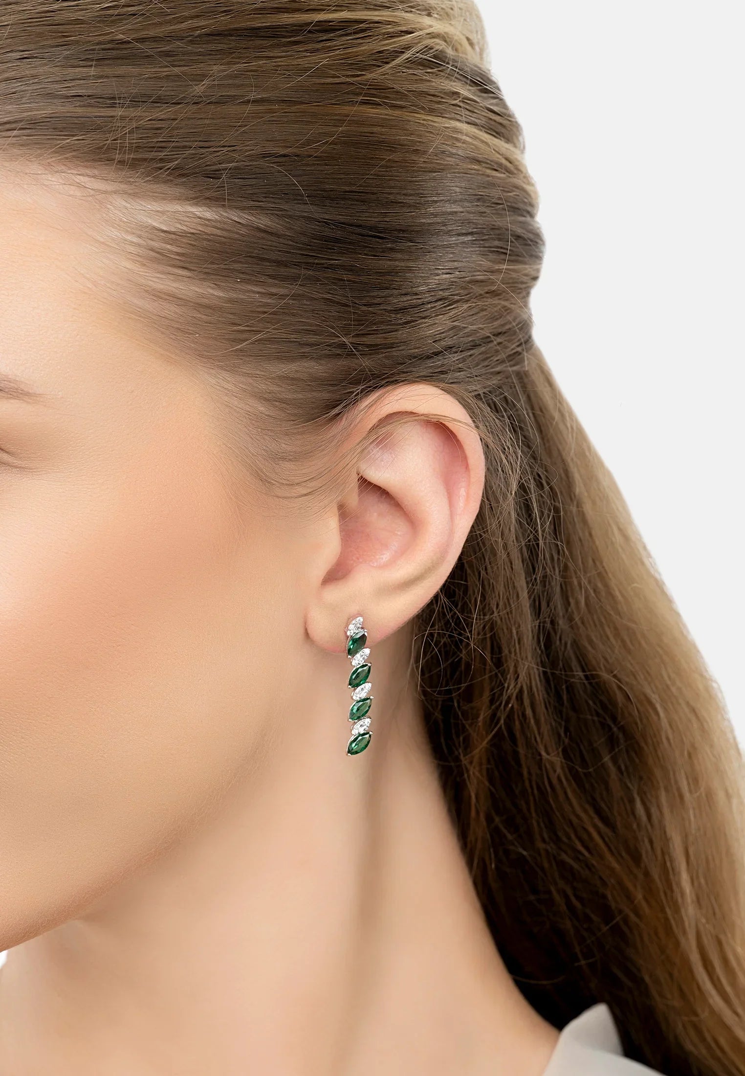 The earring worn by a model.
