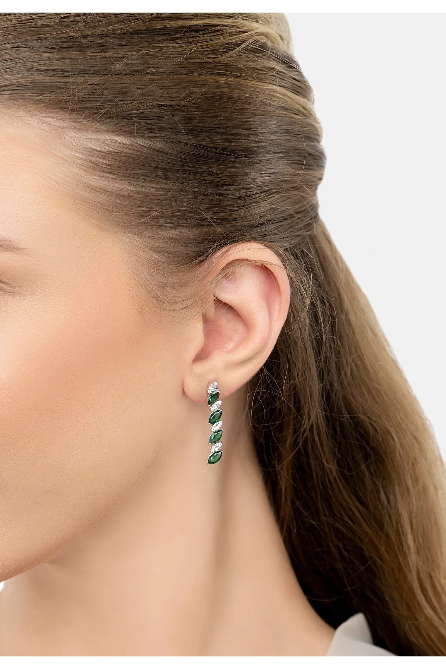 The earring worn by a model.