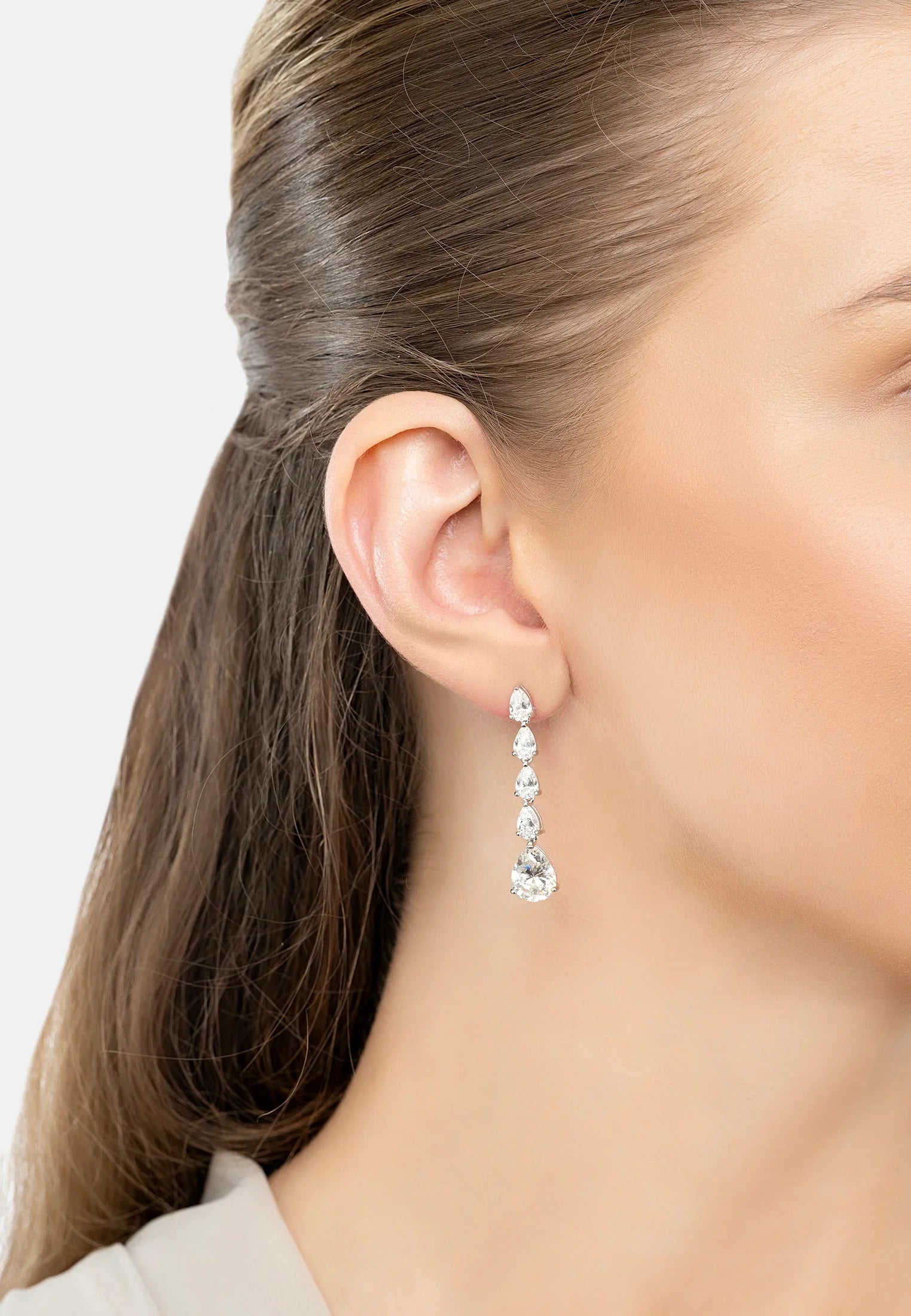 The earring worn by a model.