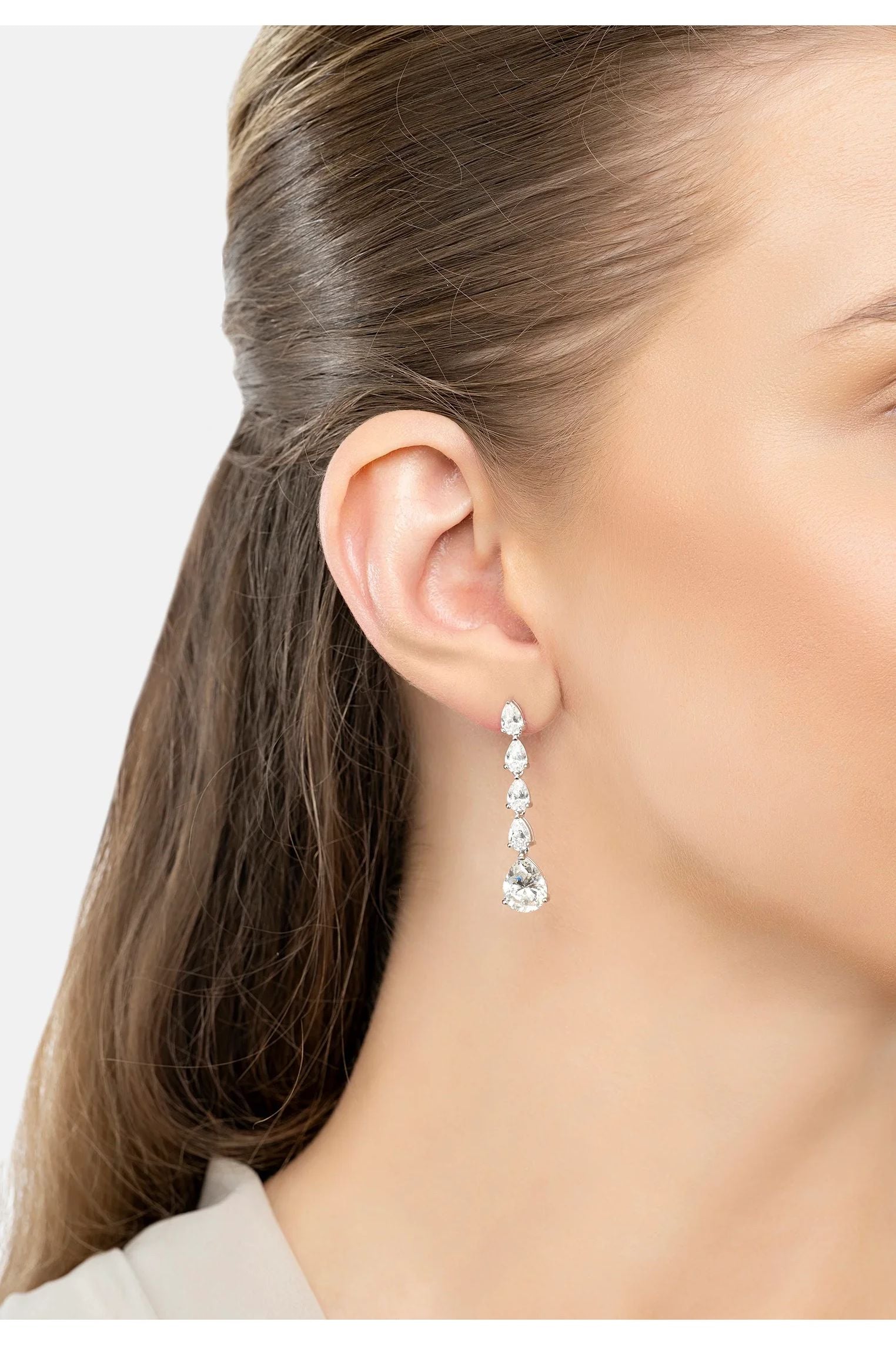 The earring worn by a model.