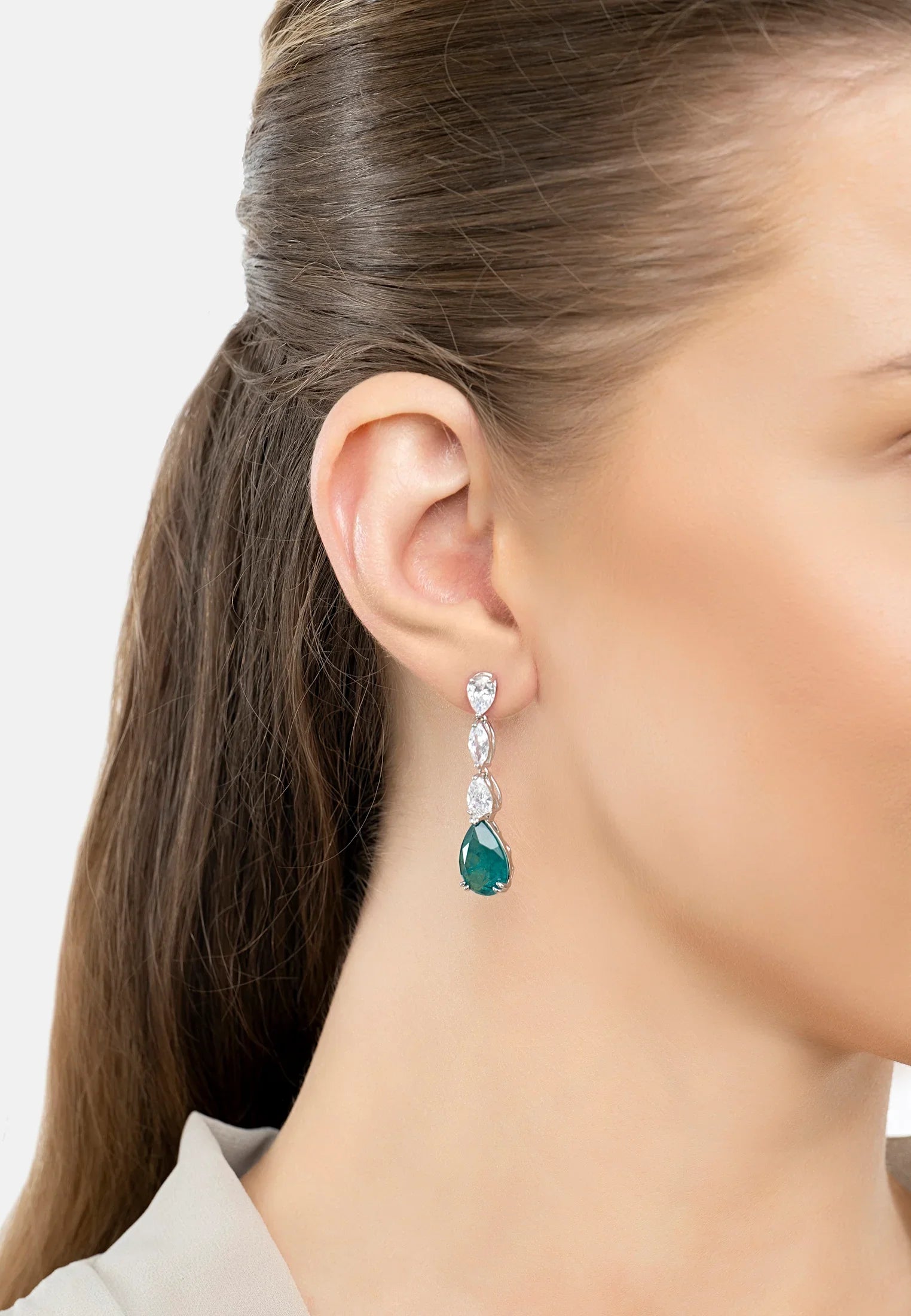 The earring worn by a model.