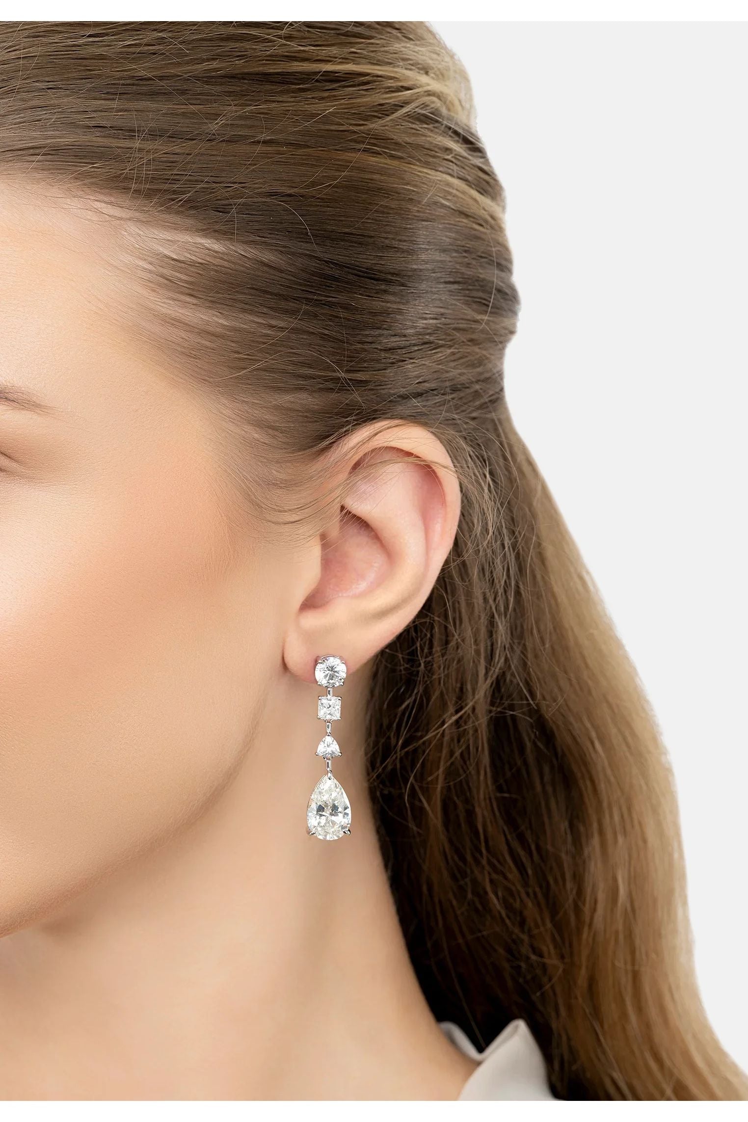 The earring worn by a model.