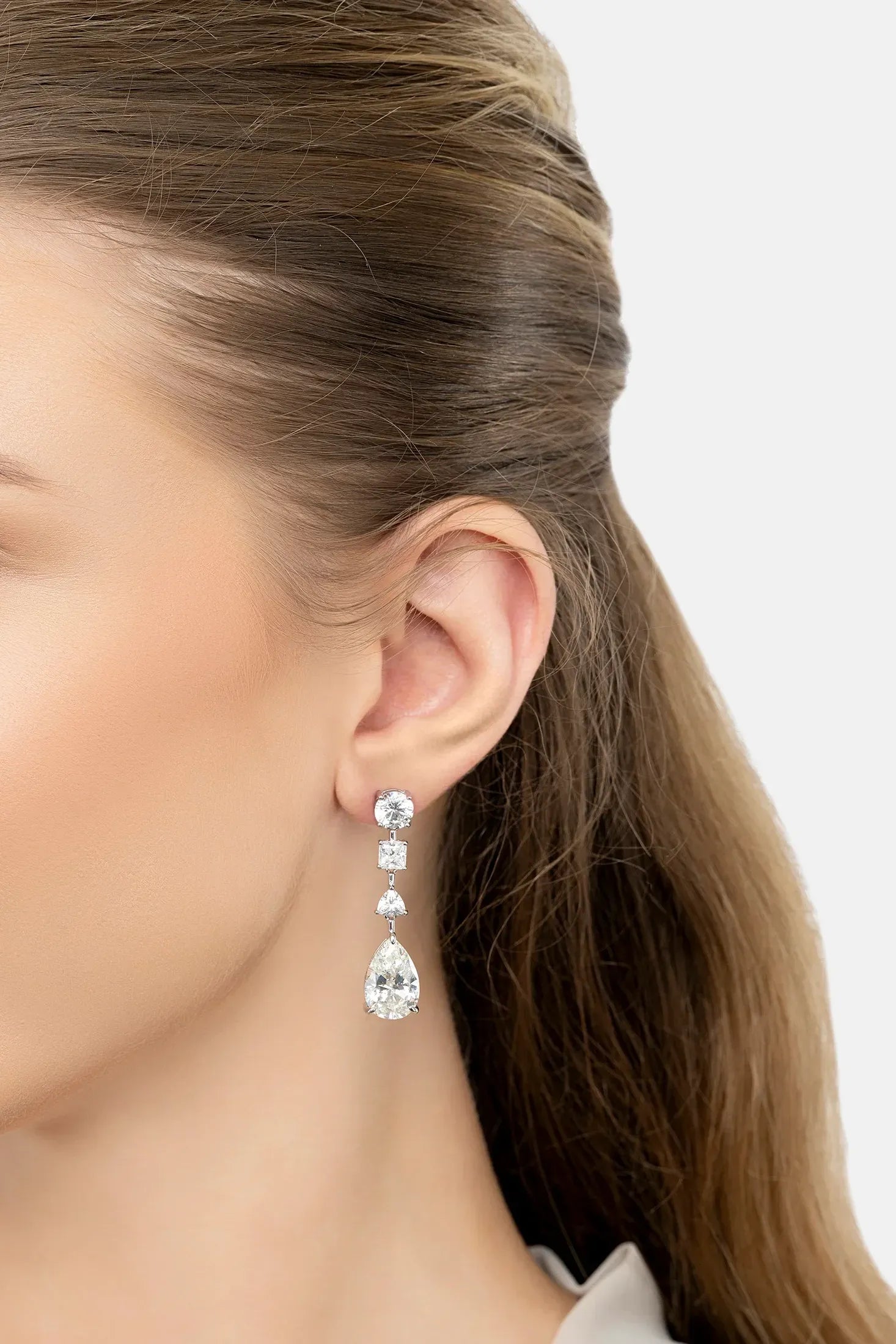 The earring worn by a model.