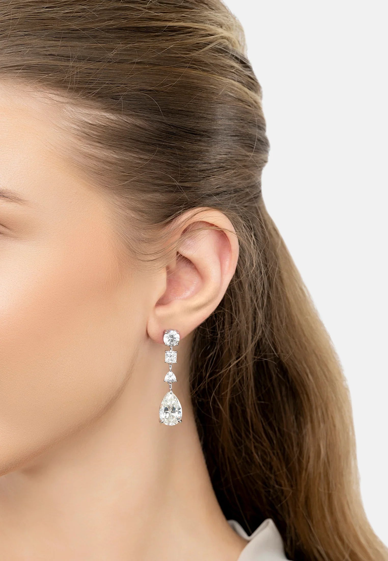 The earring worn by a model.