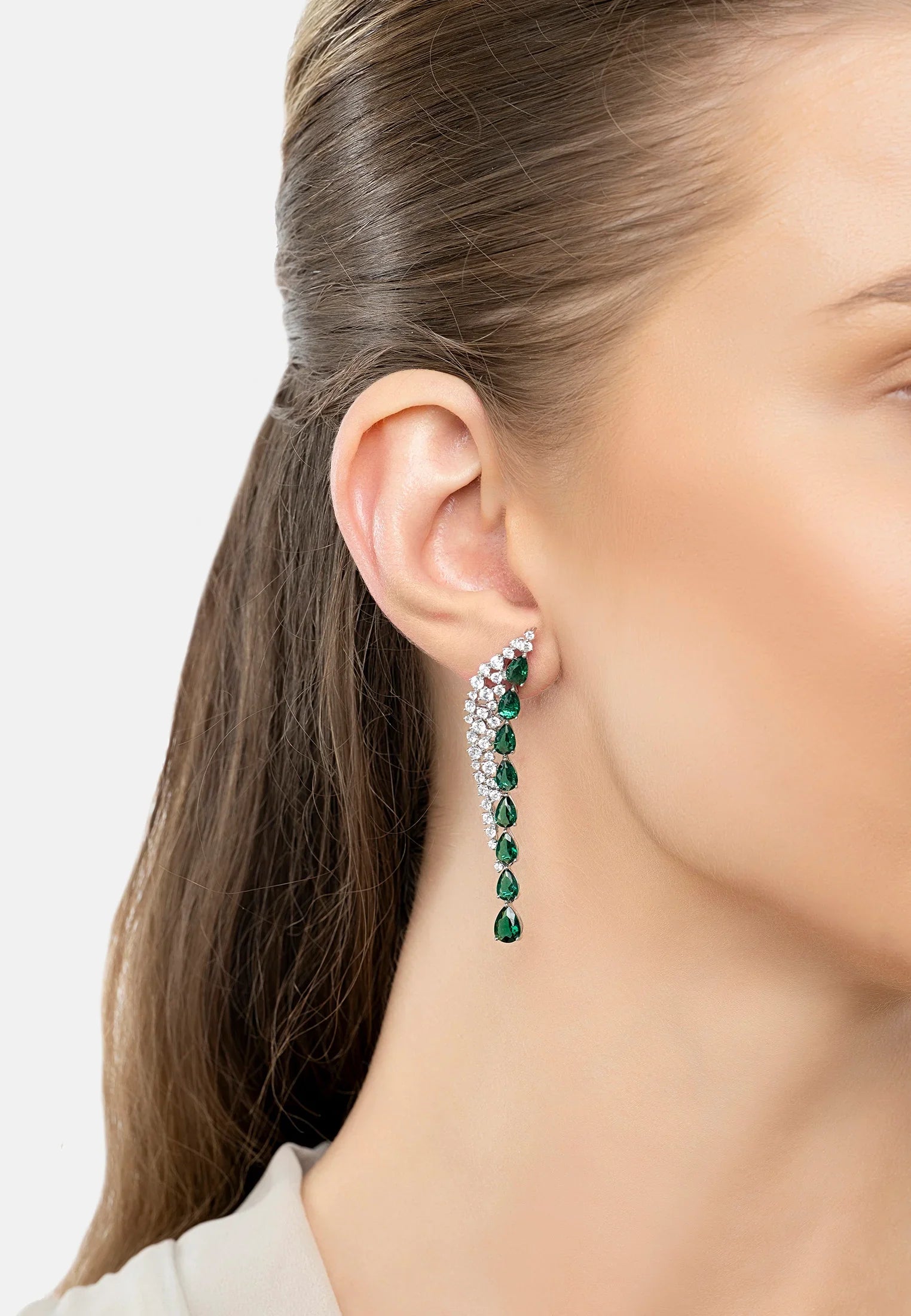 The earring worn by a model.