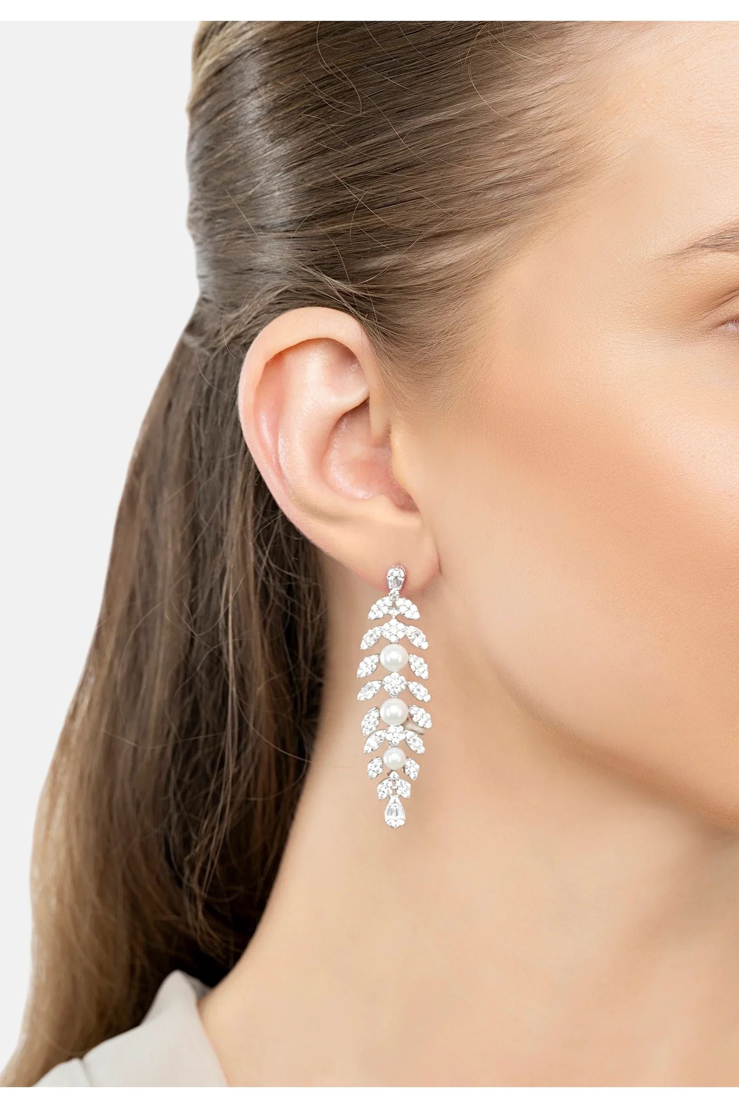 The earring worn by a model.