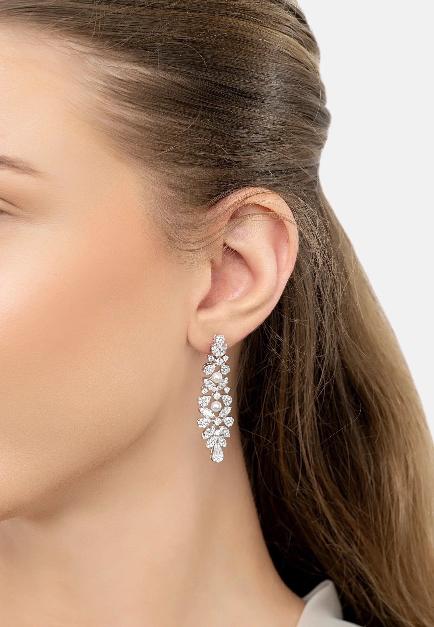 The earring worn by a model.