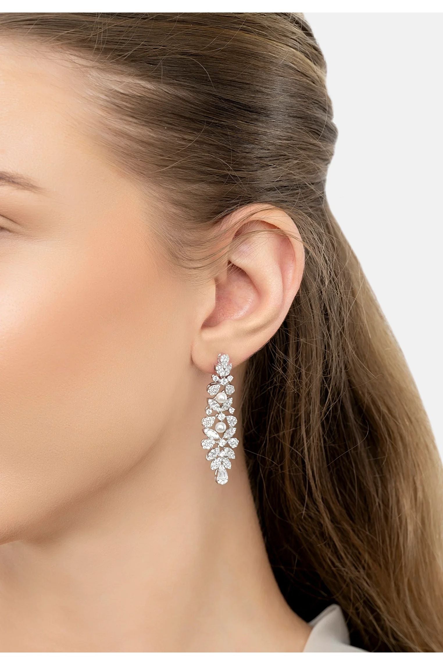 The earring worn by a model.