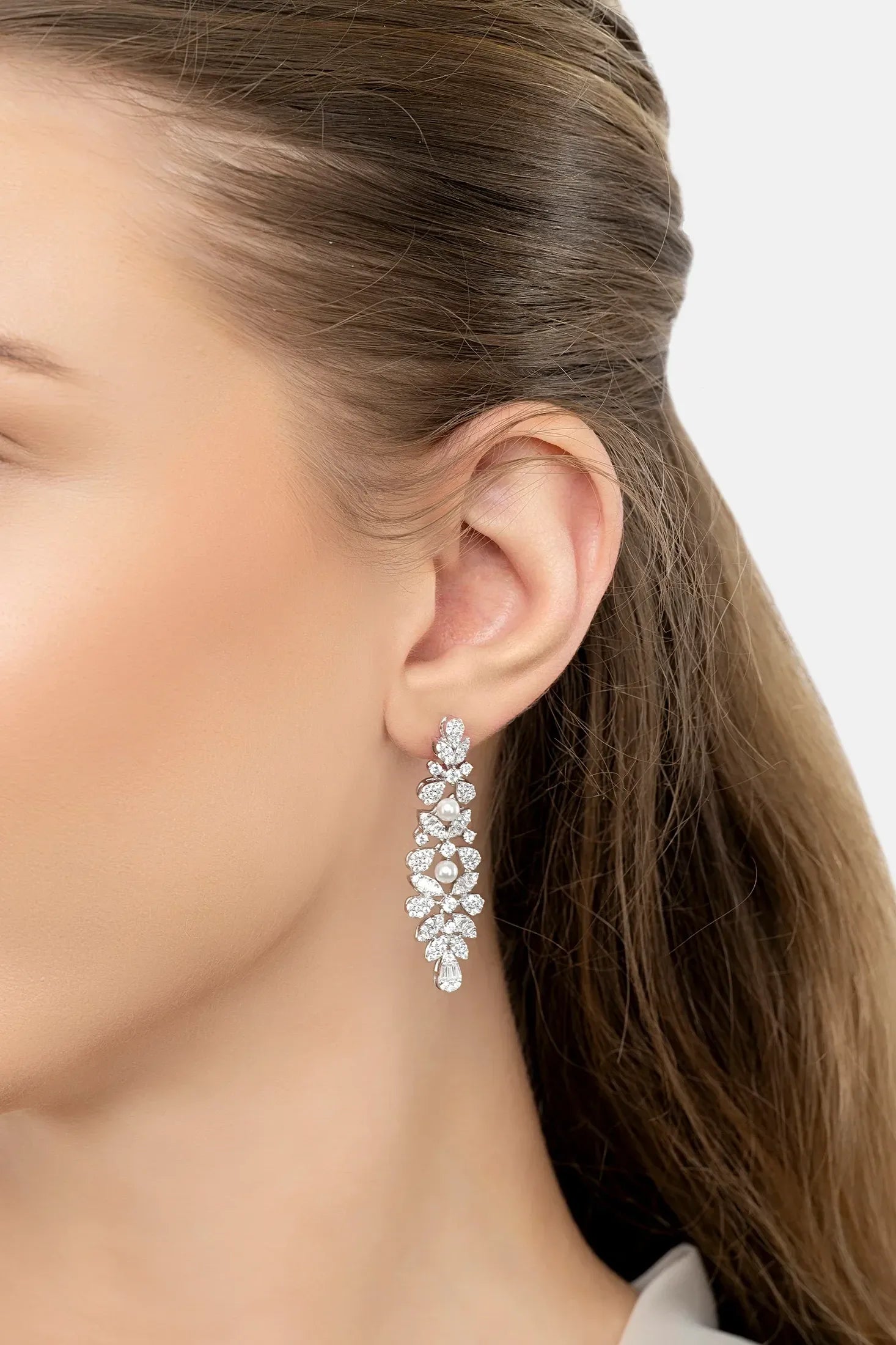 The earring worn by a model.