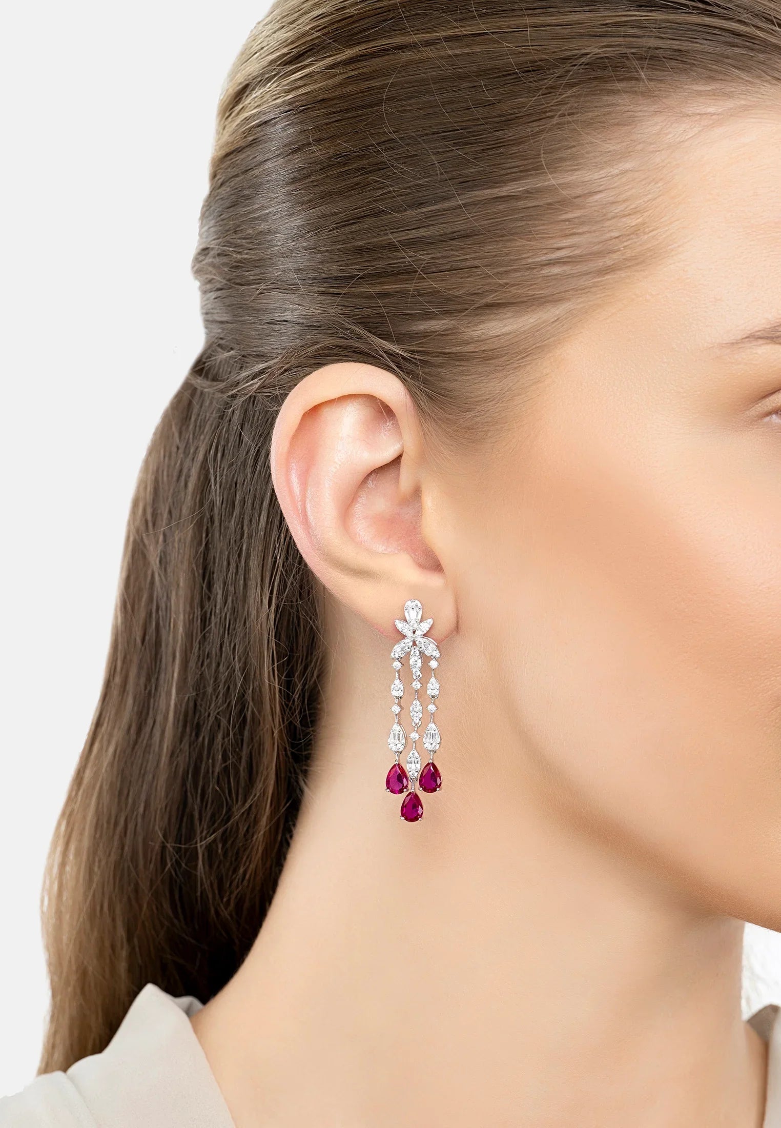 The earring worn by a model.