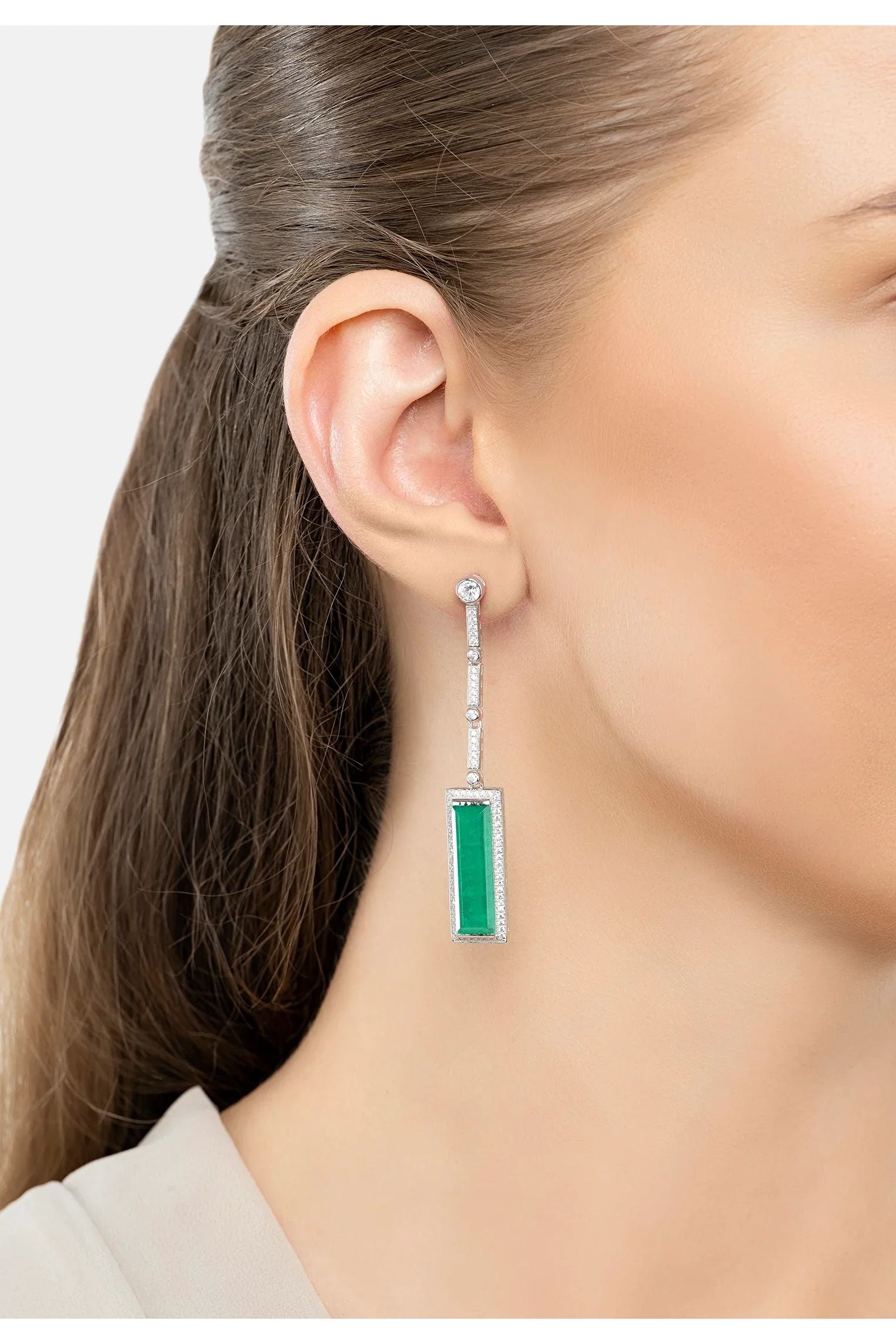 The earring worn by a model.