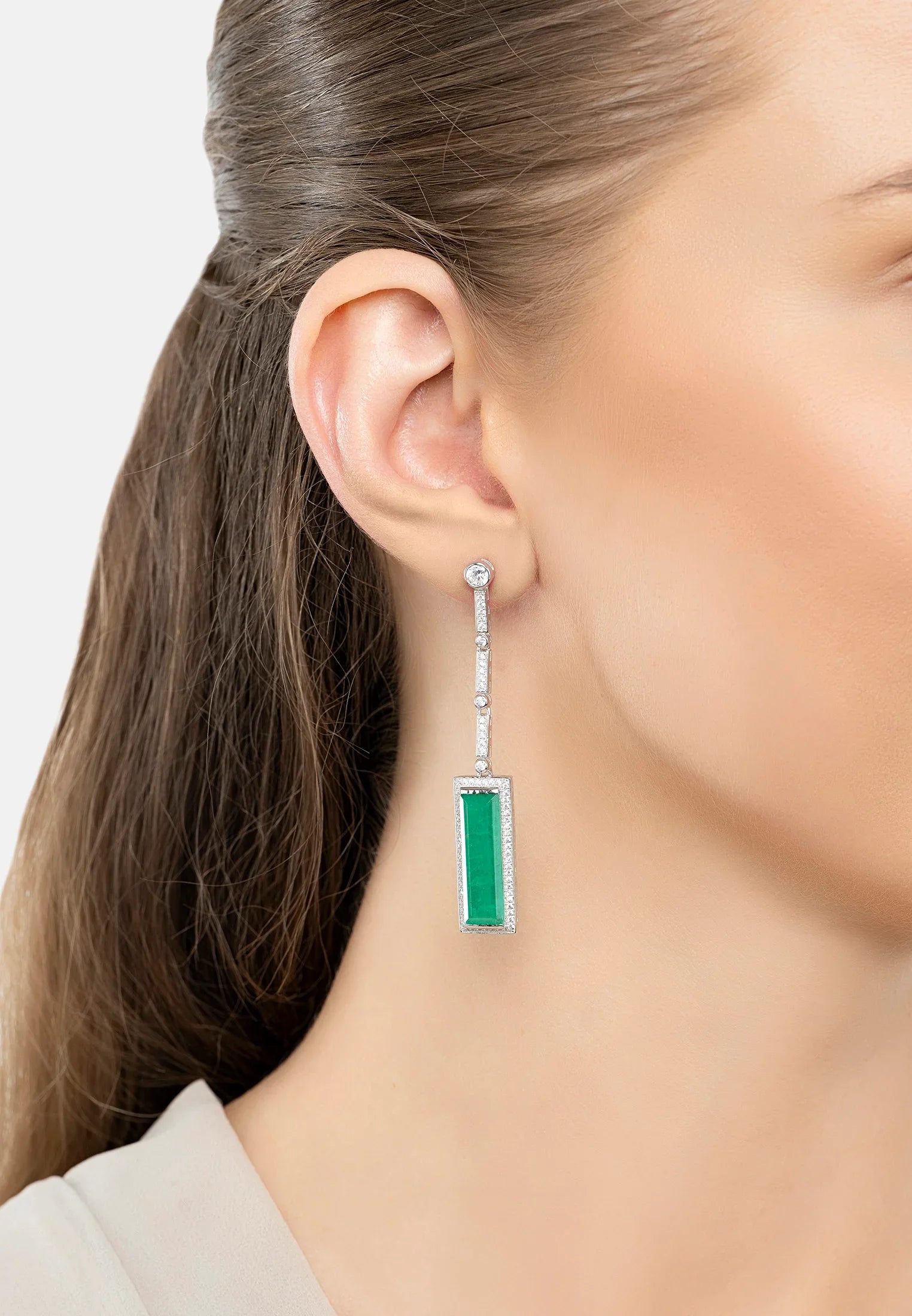 The earring worn by a model.