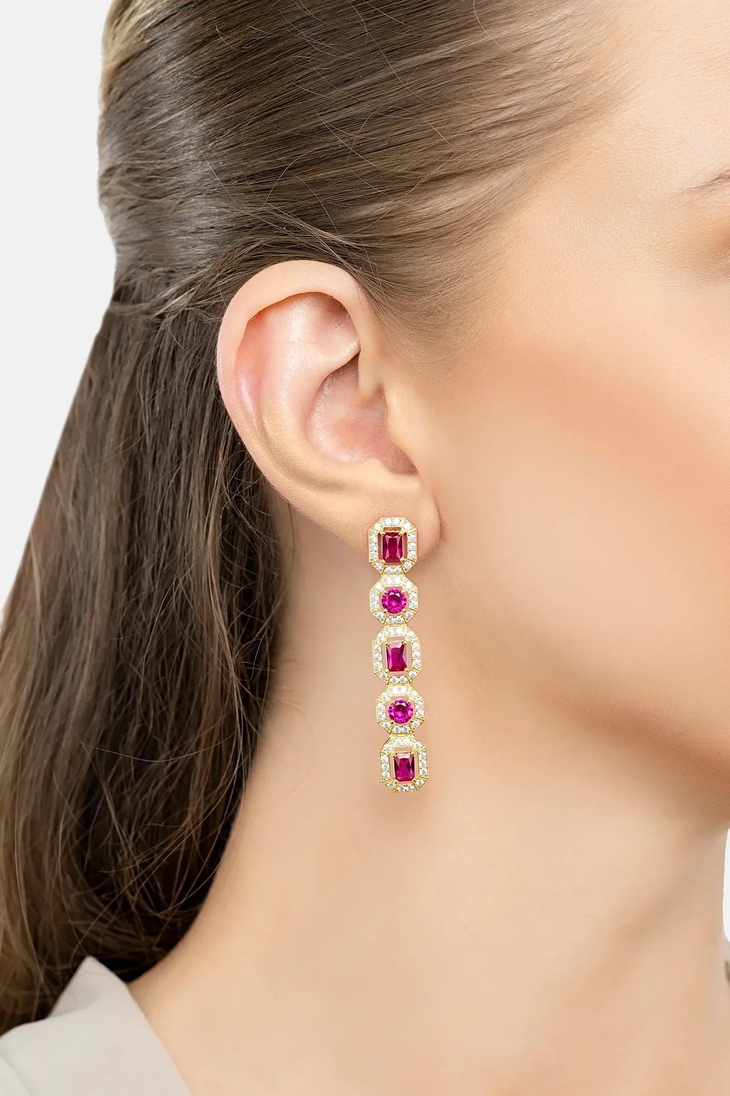 The earring worn by a model.
