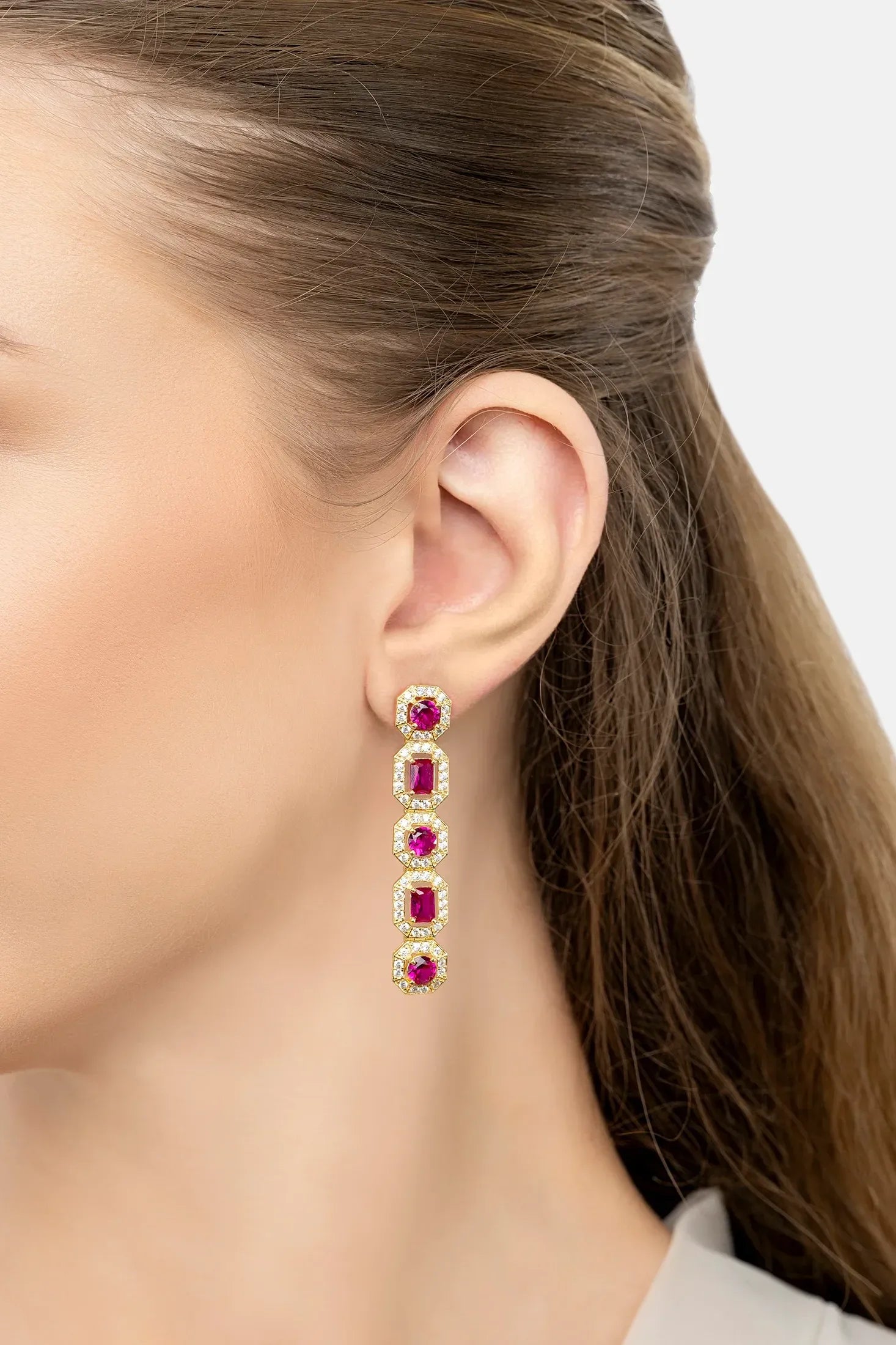 The earring worn by a model.
