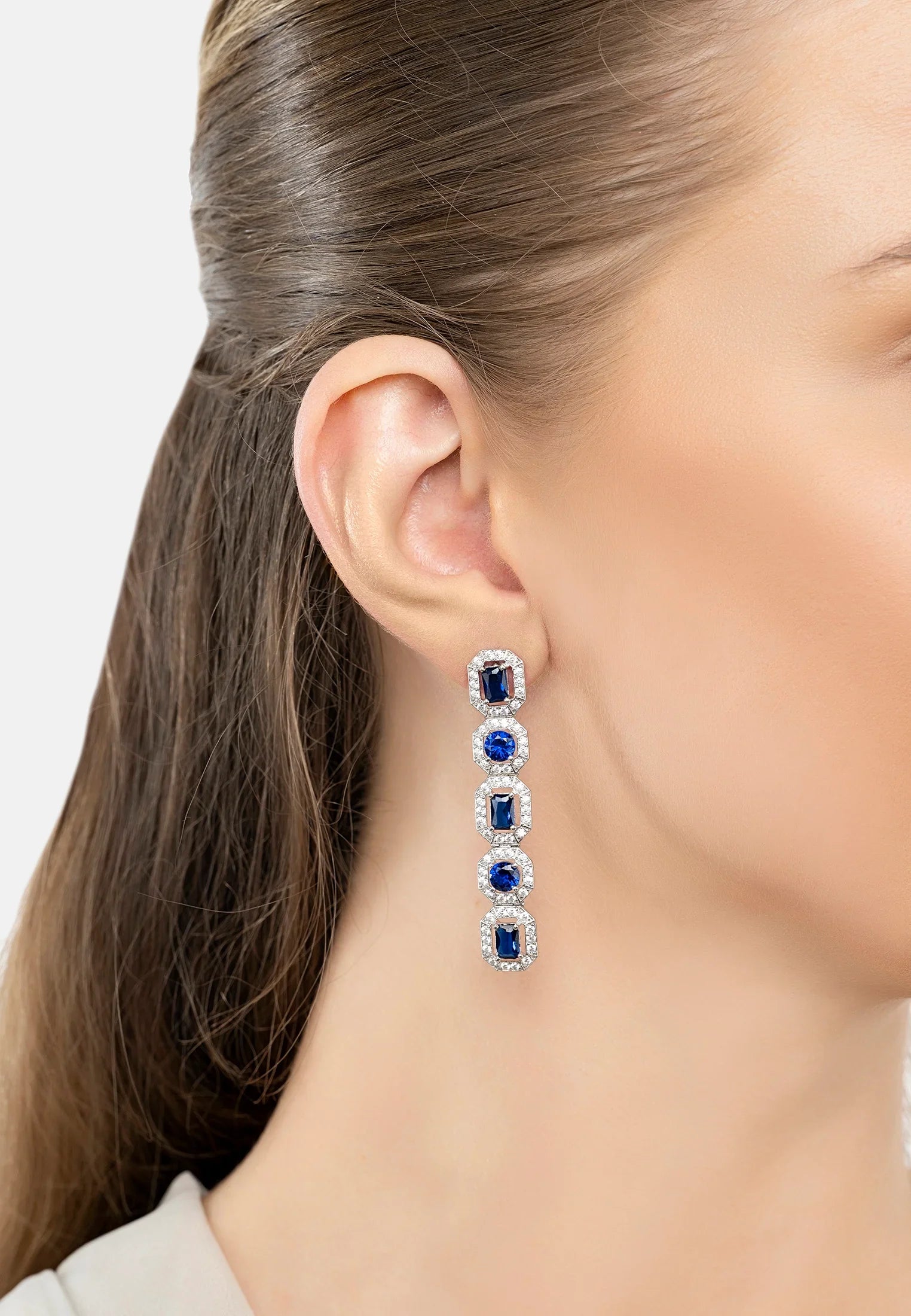 The earring worn by a model.