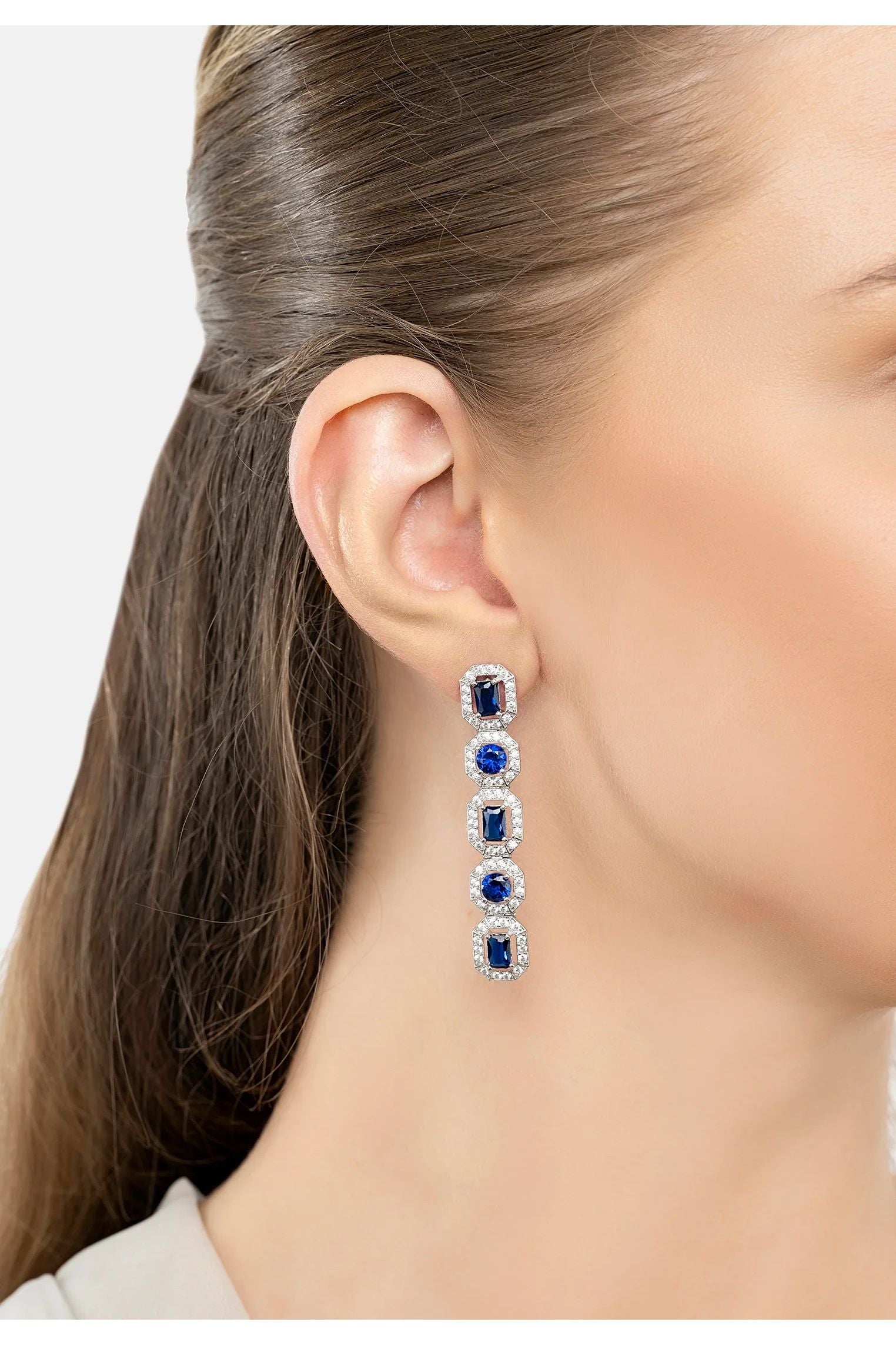 The earring worn by a model.