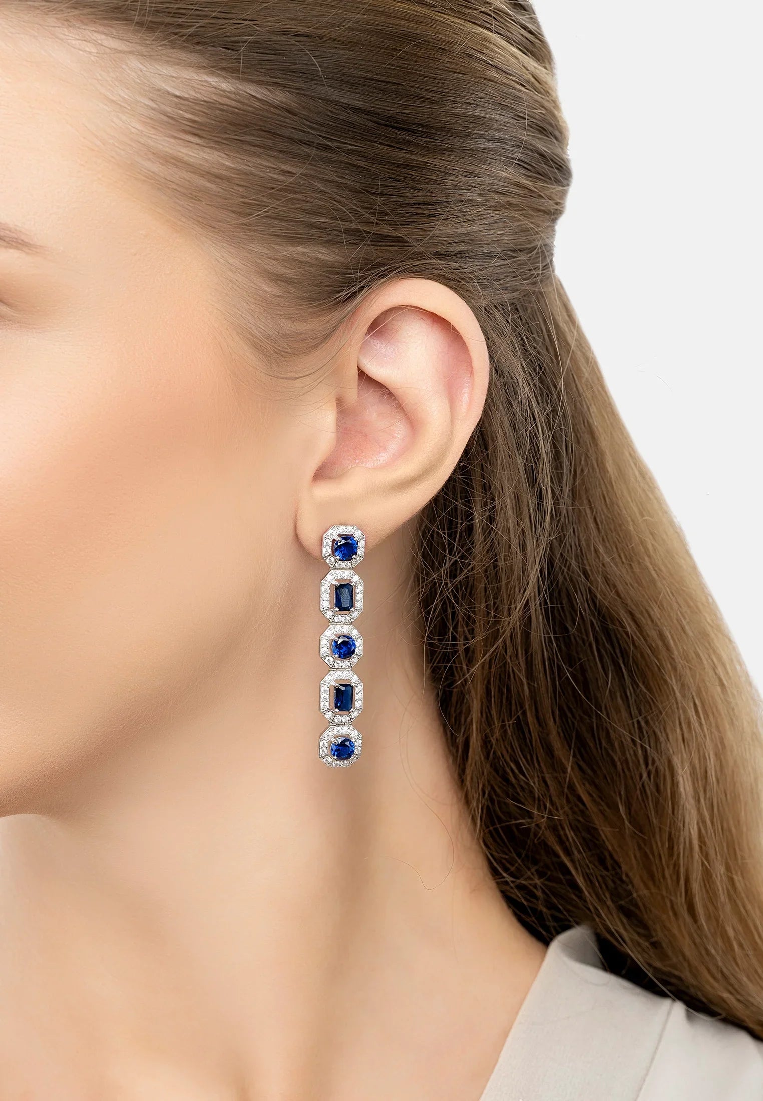 The earring worn by a model.