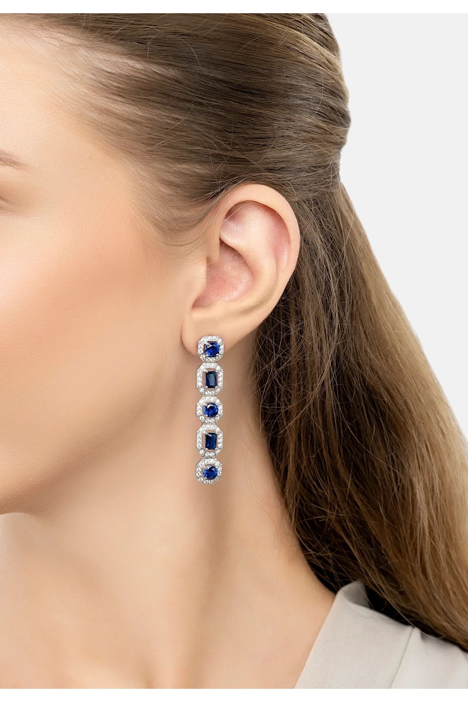 The earring worn by a model.