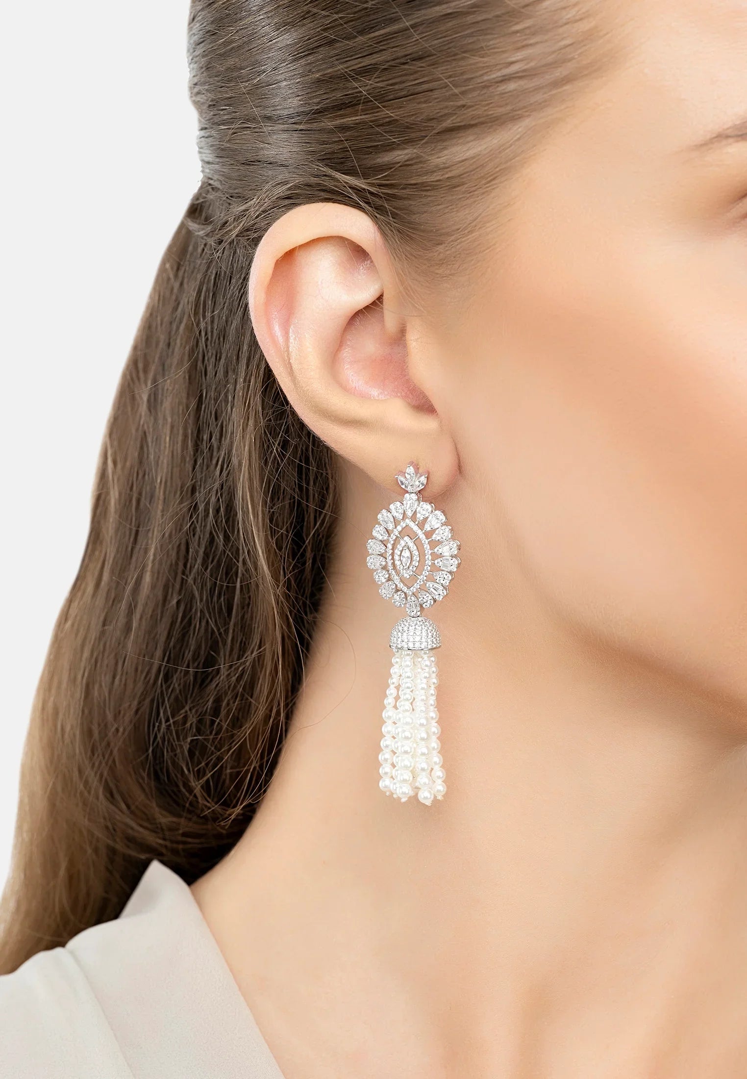 The earring worn by a model.