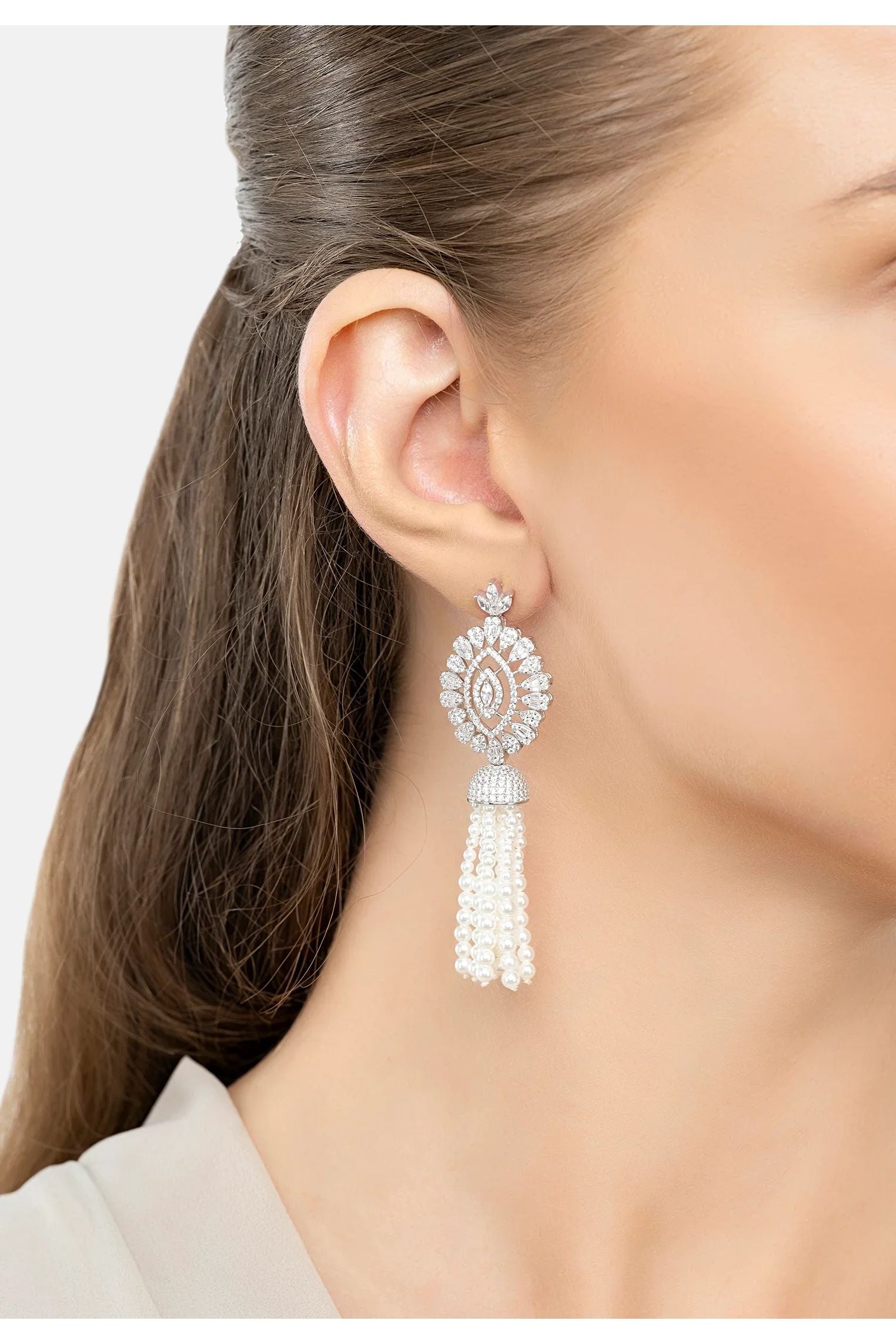 The earring worn by a model.