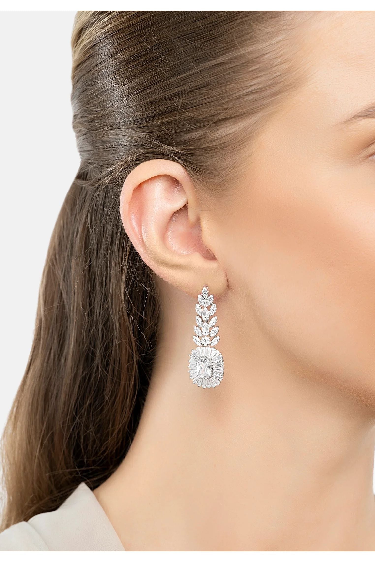 The earring worn by a model.