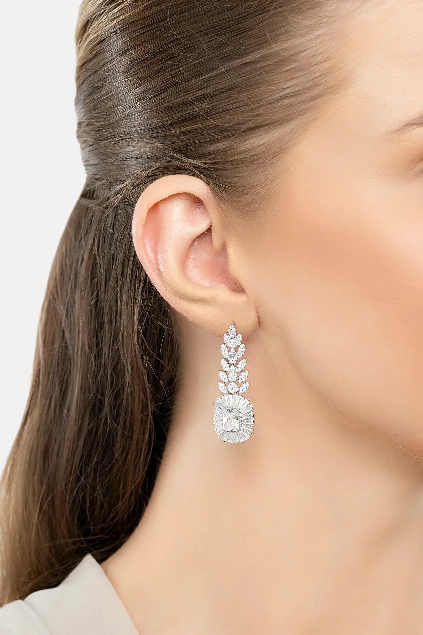 The earring worn by a model.