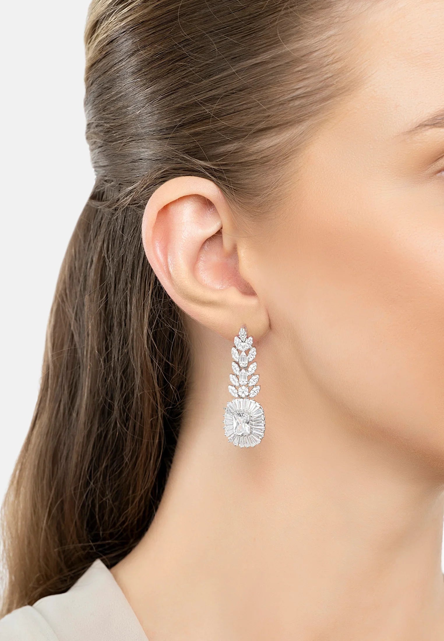 The earring worn by a model.